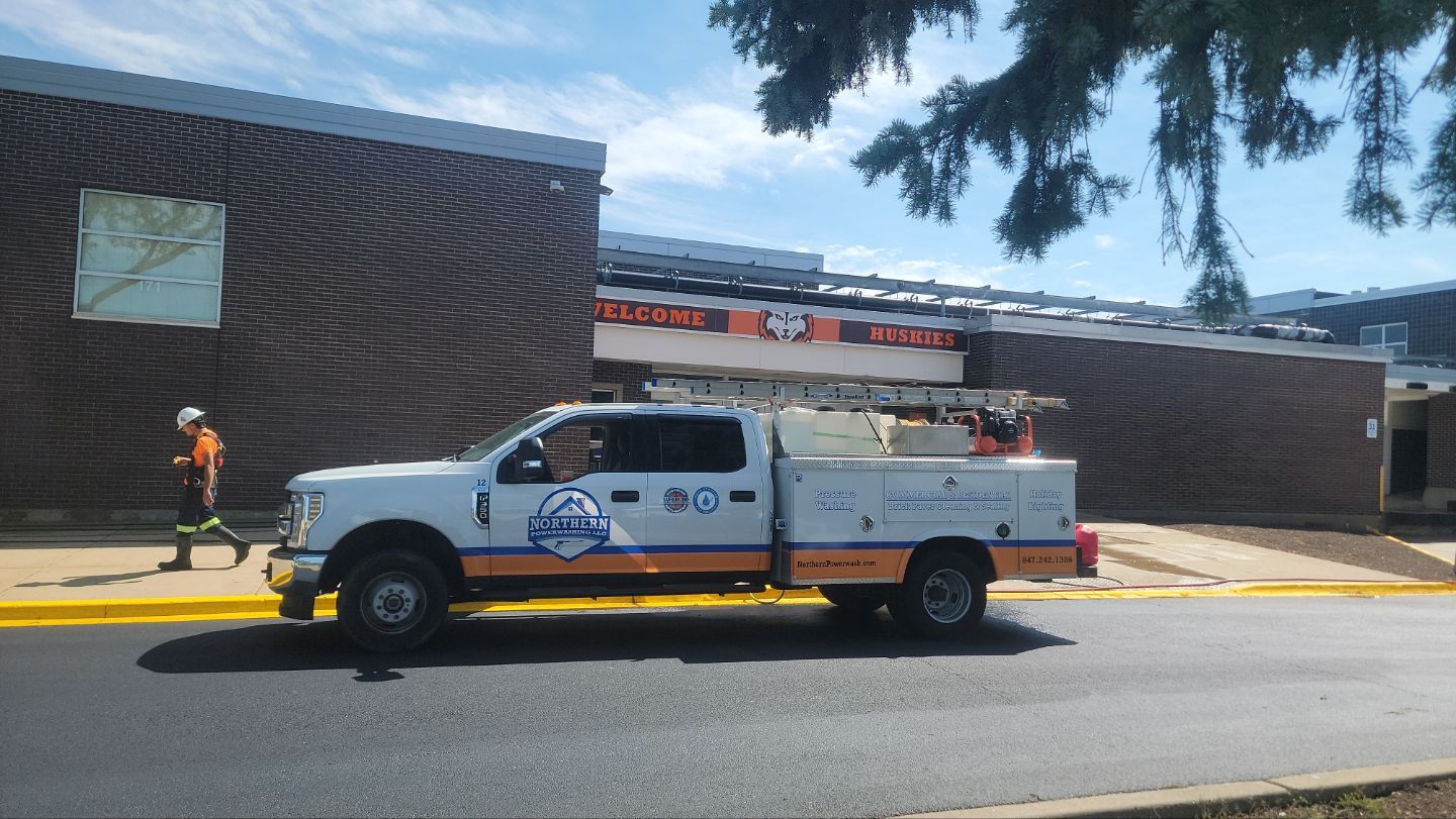 commercial pressure washing using Algaecide, soft wash soap by Northern Power Washing LLC.
