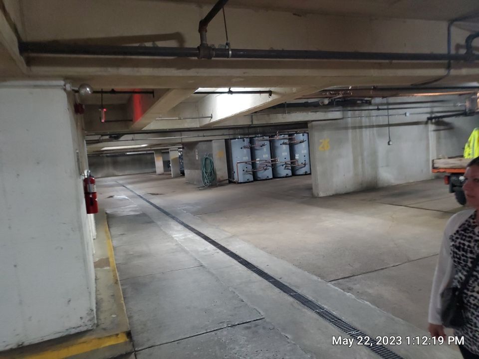 Parking garage using Hot water by Northern Power Washing LLC.