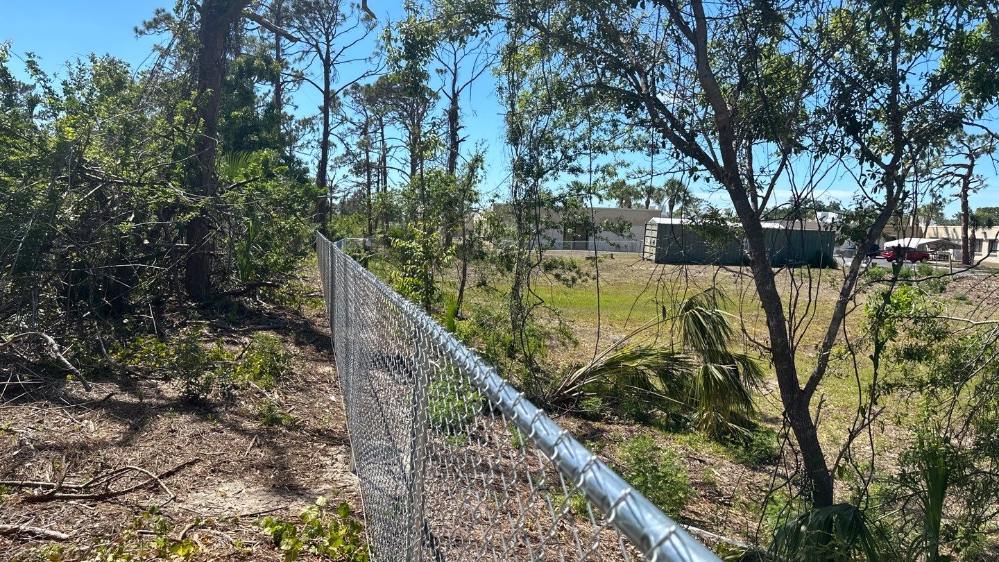 Commercial Chainlink and Vinyl Fence With Aluminum Framed Gates On Dumpster Enclosure by Asap fence and gates, LLC
