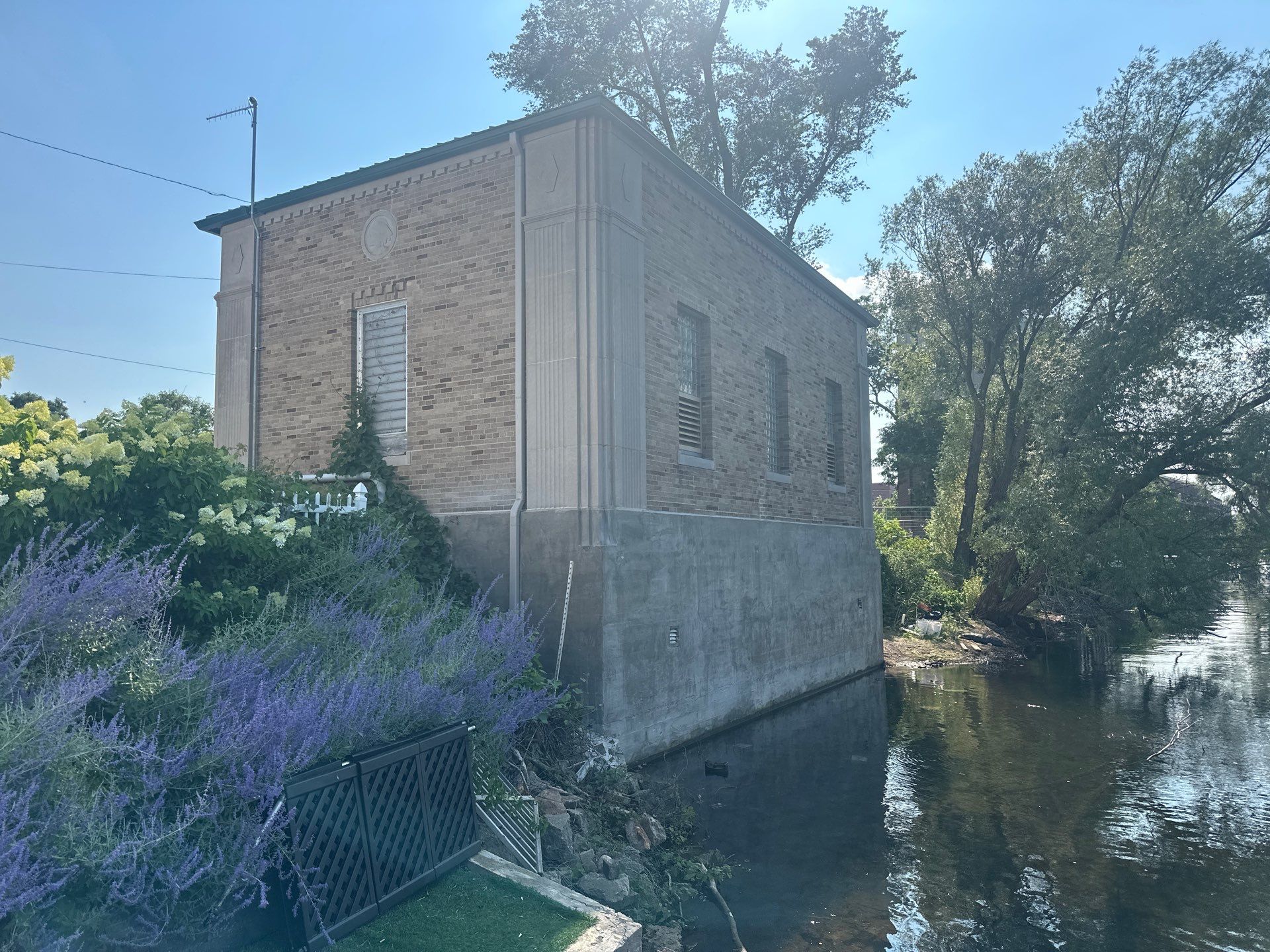 Gutter and Gutter Screen Installation for Traverse City Masonry Building by Rainbow Seamless Systems