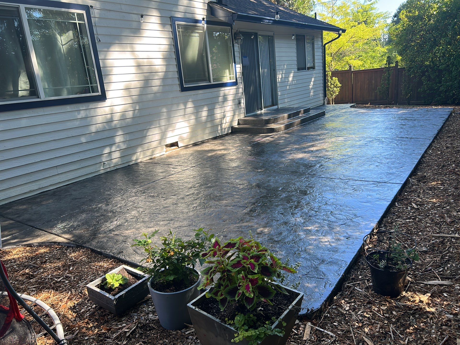 Luo | Colored Stamped Concrete Patio by Jireh Asphalt & Concrete Inc 