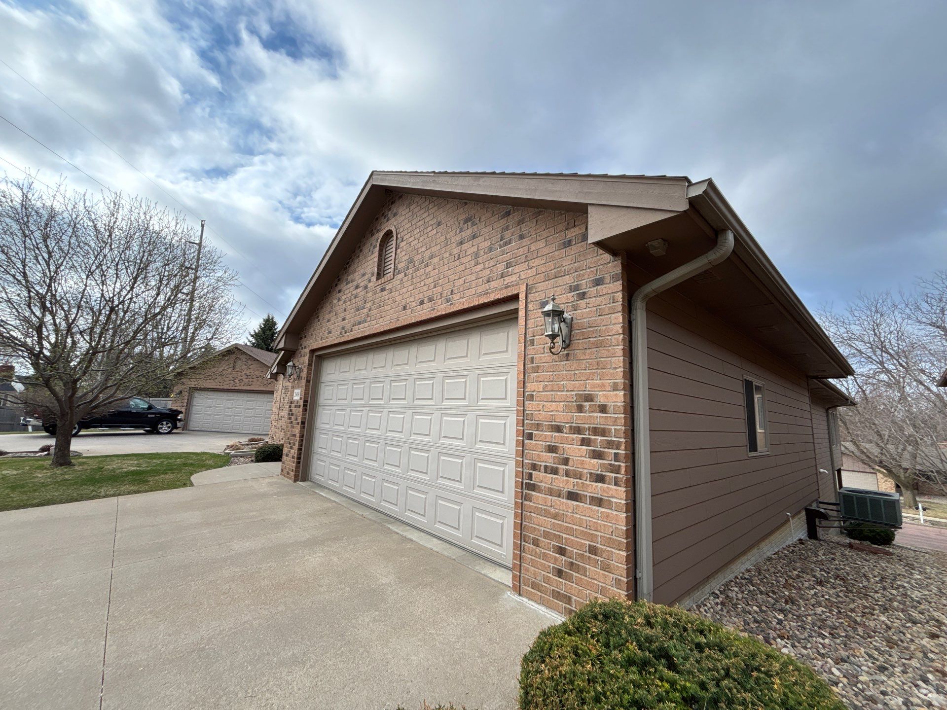 Multi-Story Residential Exterior Painting and Siding Refresh in Sioux Falls by Select Painting, Coatings & Garage Cabinets