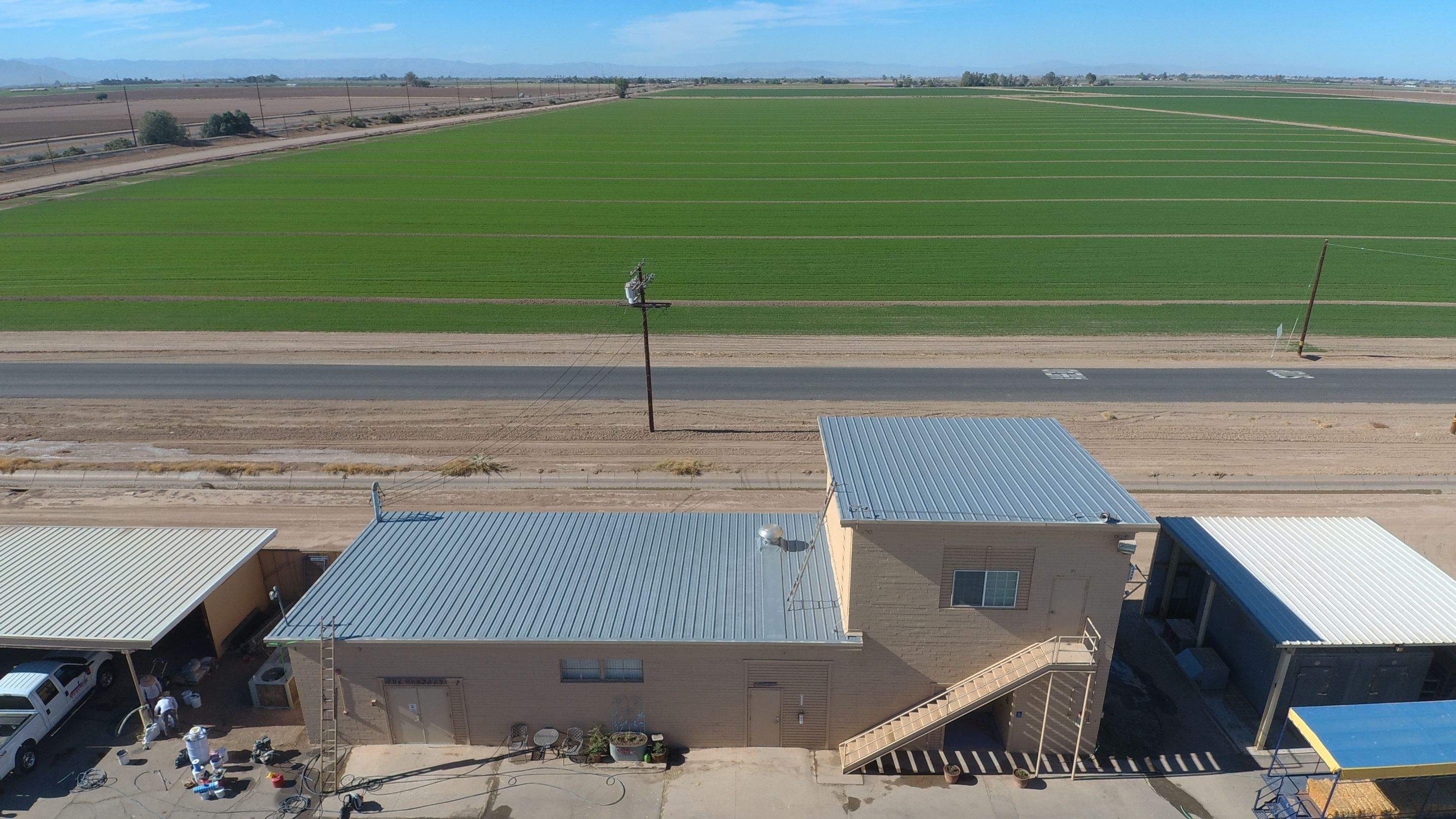 Metal roof restoration on commercial roof using Conklin Benchmark/PUMA XL fabric and coating by Straight Edge Roofing Inc