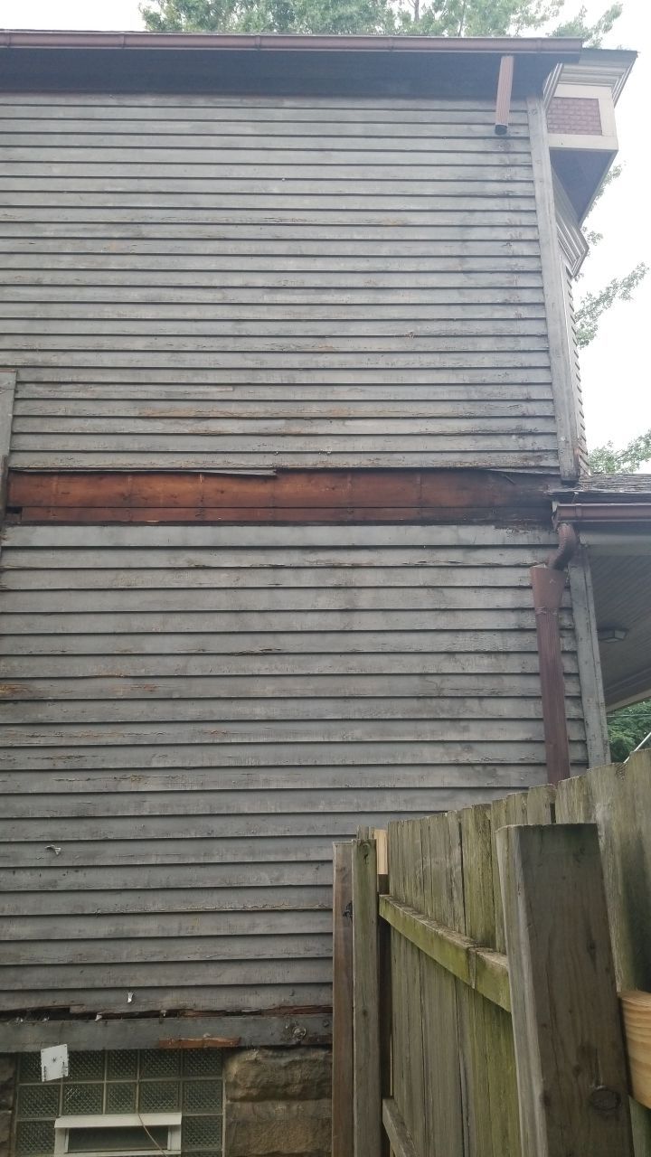 James Hardie Siding on Antique Home by Absolute Roofing and Construction