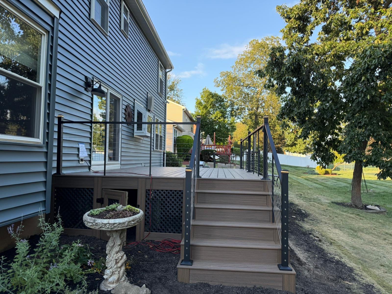 Deck resurface with Trex and cable rails by deck guardian