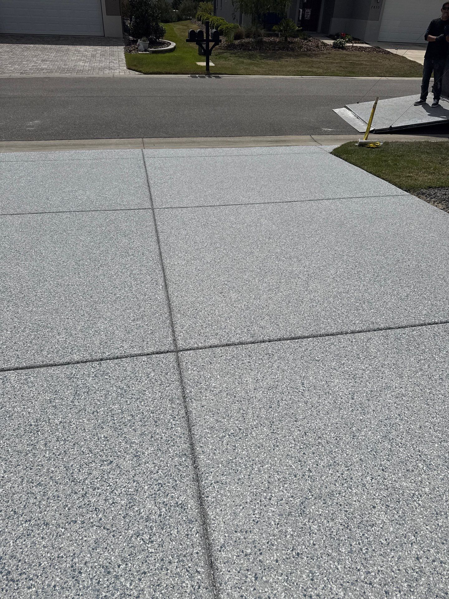 Driveway with Border Slatestone  by Innovative Concrete Coatings 