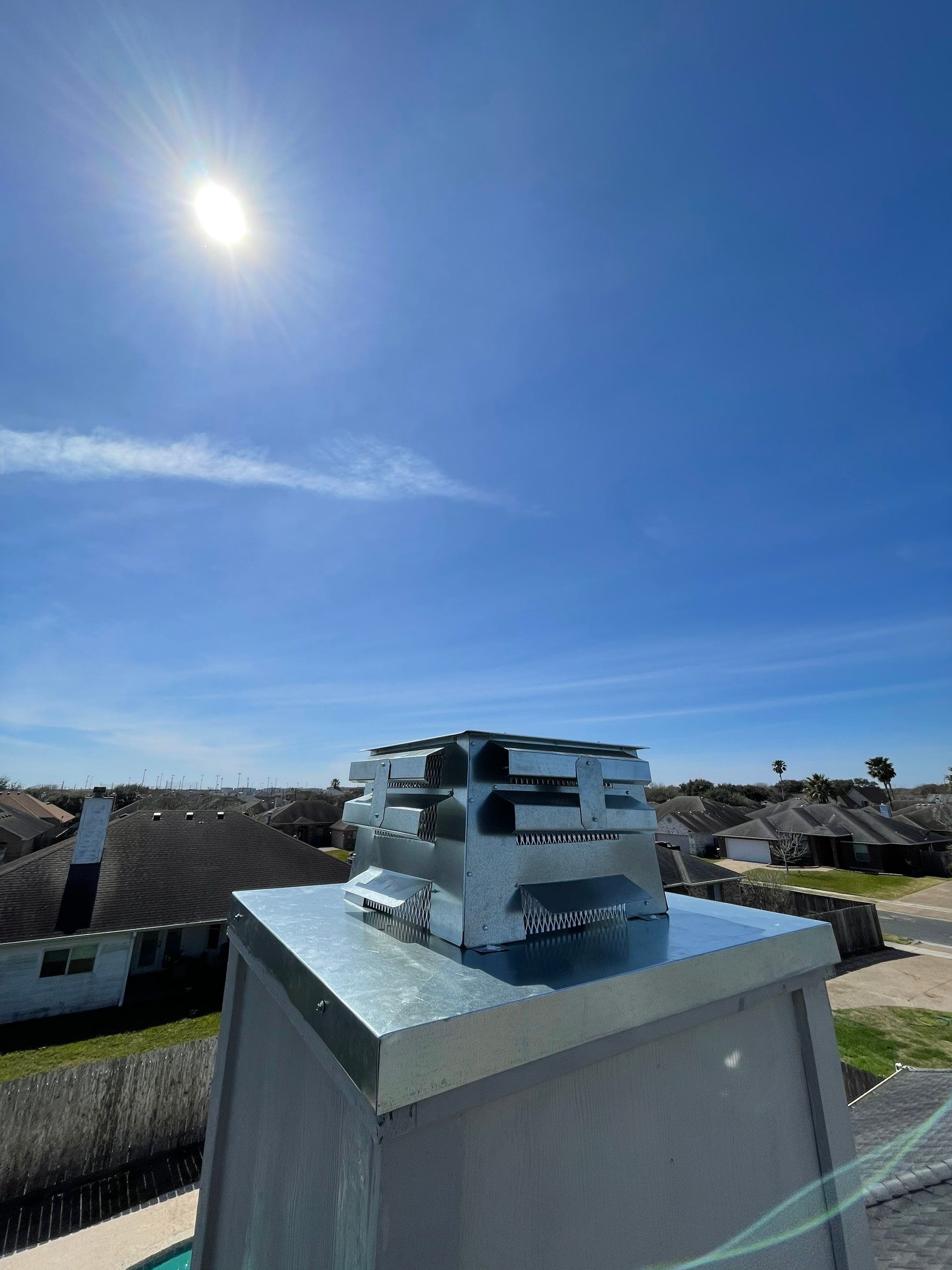 Residential Roofing Repair Replacing Chimney Cap by Lighthouse Roofing
