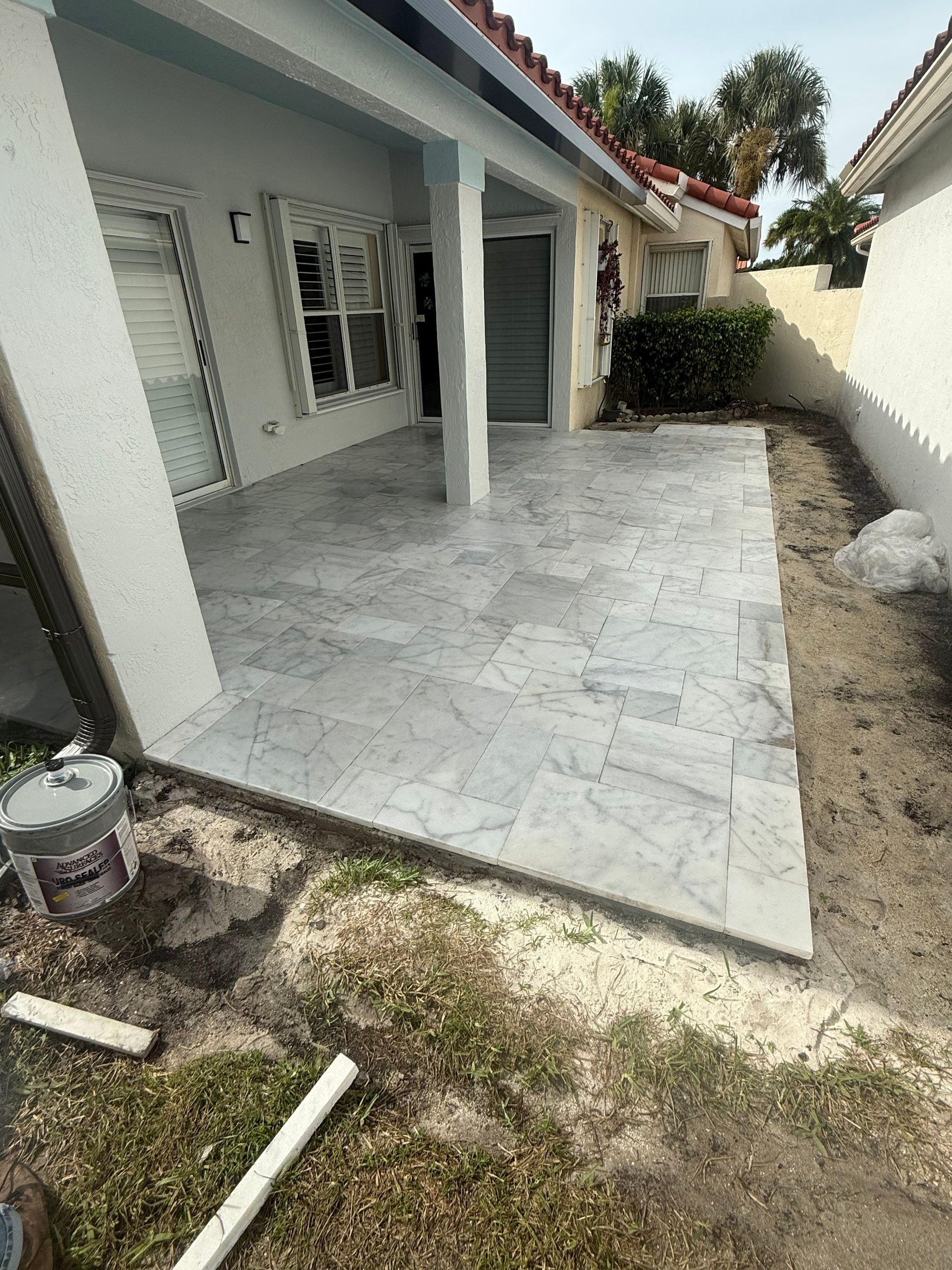 Bronze Aluminum Screen Enclosure and Marble Tile Patio in Boynton Beach by The Screen Depot, Inc