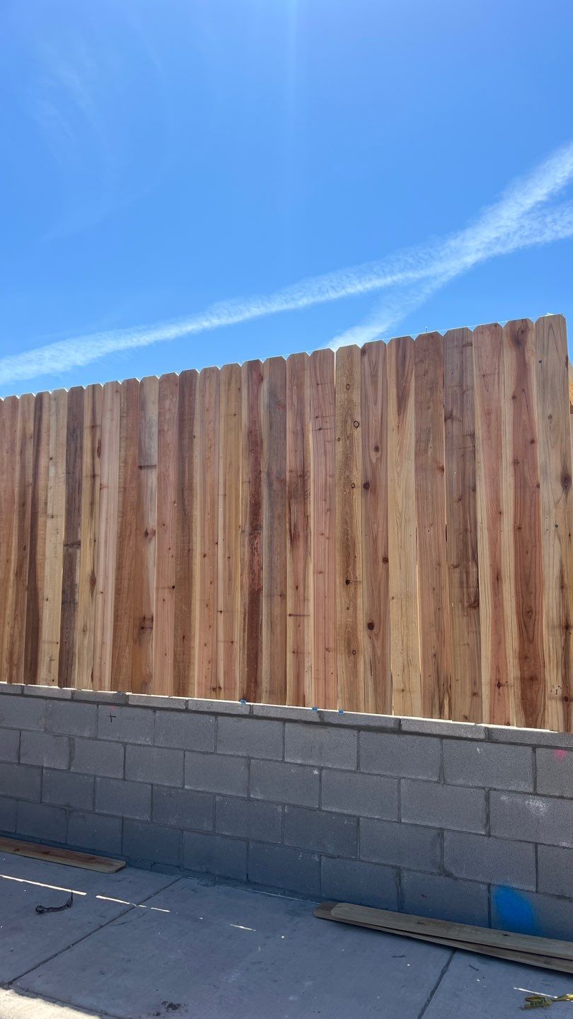 Cedar Fence using Cedar Pickets and Metal Poles by Clays Services Inc