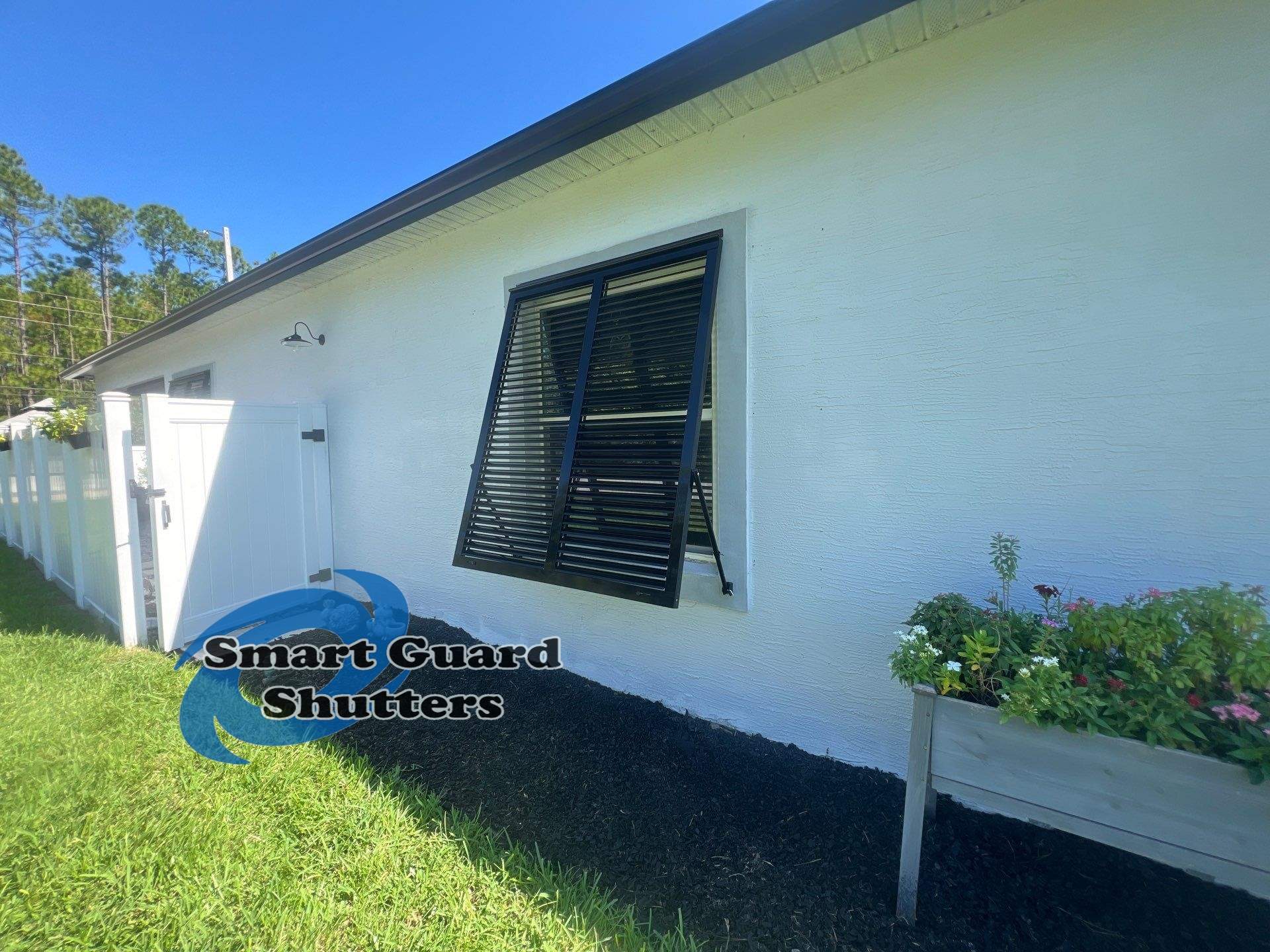 Impact Bahama Shutters in Jet Black by Smart Guard Shutters