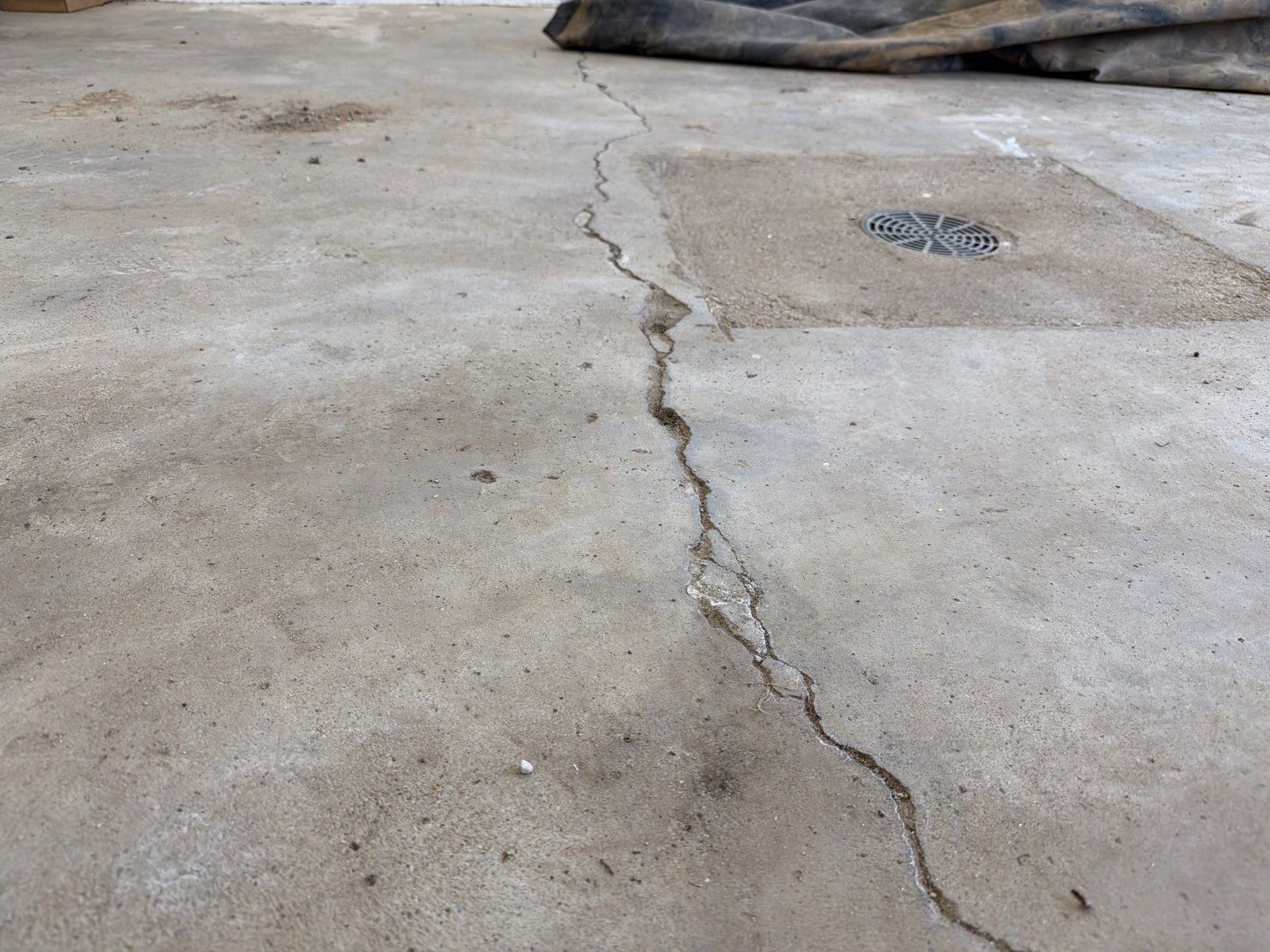 Feather Grey Garage Floor Coating and Crack Repair in Beresford by Select Painting, Coatings & Garage Cabinets