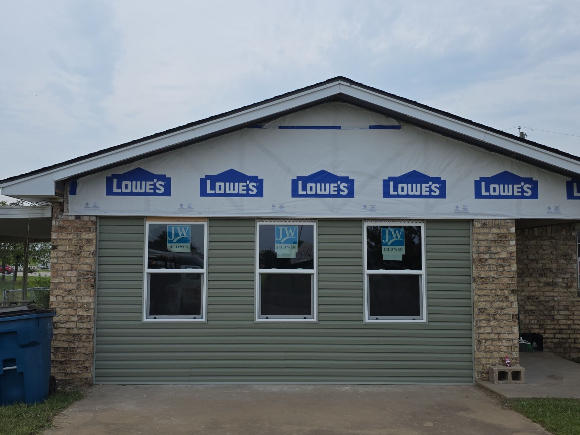 New roof & siding paid by insurance. Along with new roof sheathing.  by In & Out Construction & Remodeling, LLC