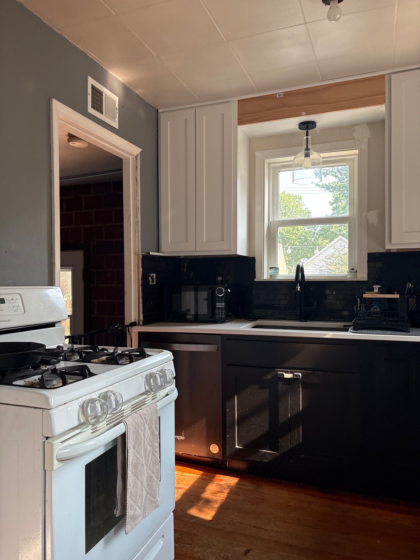 Lincoln Kitchen Remodel With Black and White Two-Tone Cabinetry by CompanyCam Sales Demo