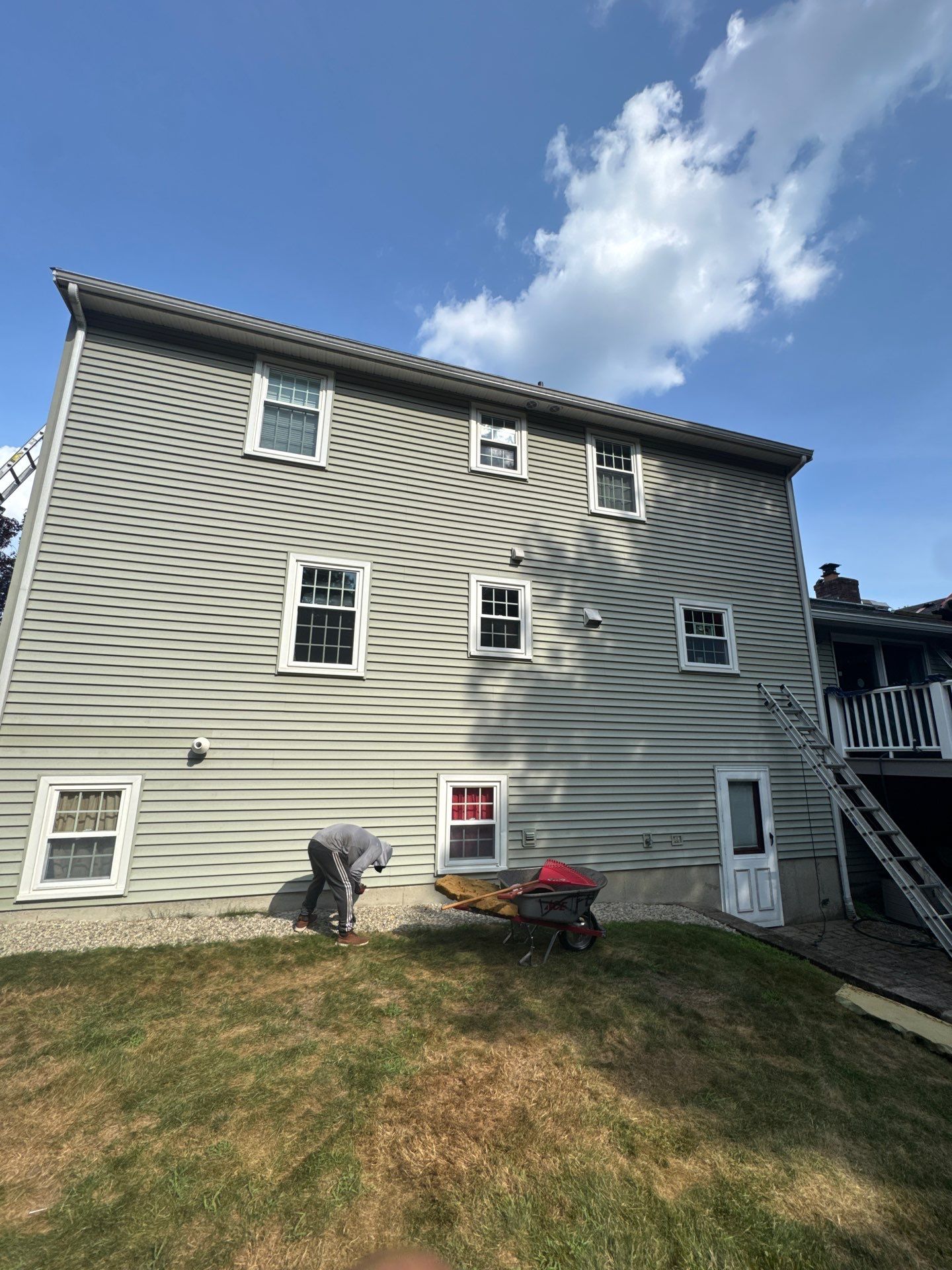 Complete Roof Replacement with Chimney Flashing, Gutter Guard System, and Vinyl Siding Repairs by Mighty Dog Roofing of Greater Middlesex County