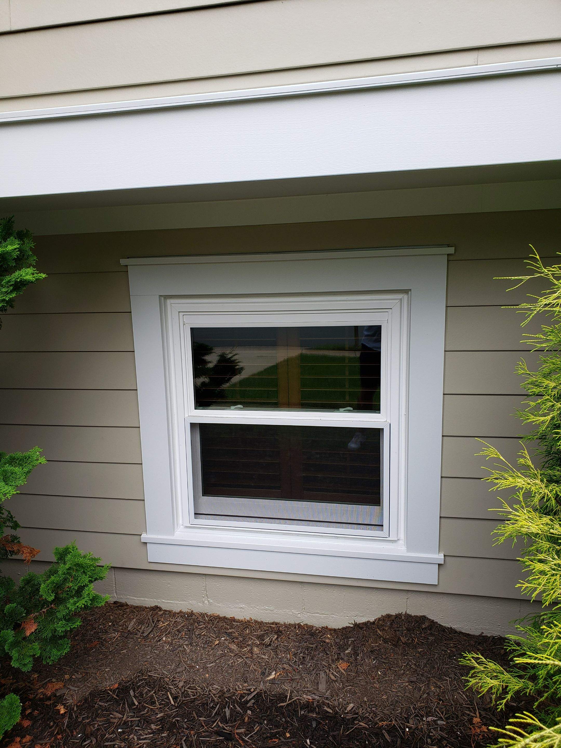 New composite windows and fiber cement siding with trim and gutters by Window Depot of Annapolis