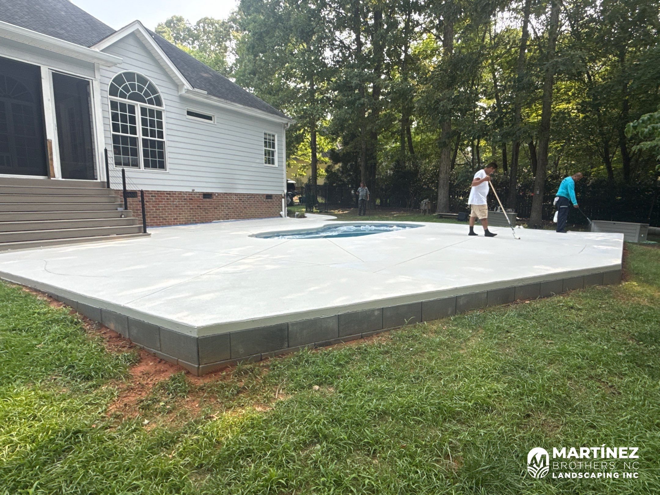Cool decking pool in Youngsville by Martinez Brother’s Nc Landscaping Inc