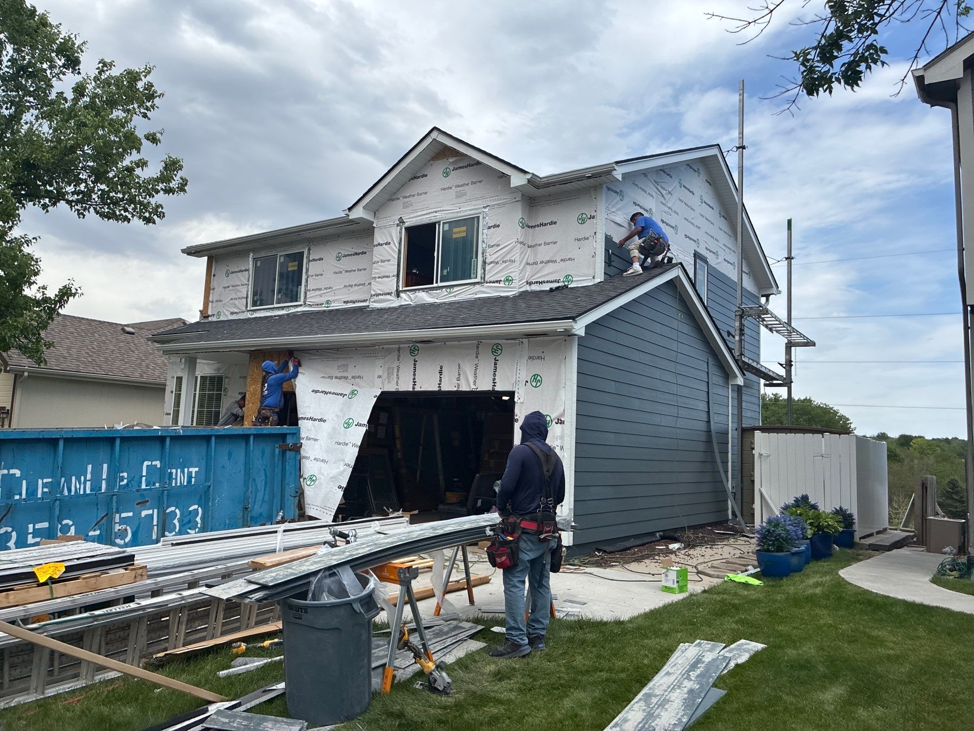 James Hardie Siding and Window Replacement with Arctic White Trim by Carps Complete Exteriors