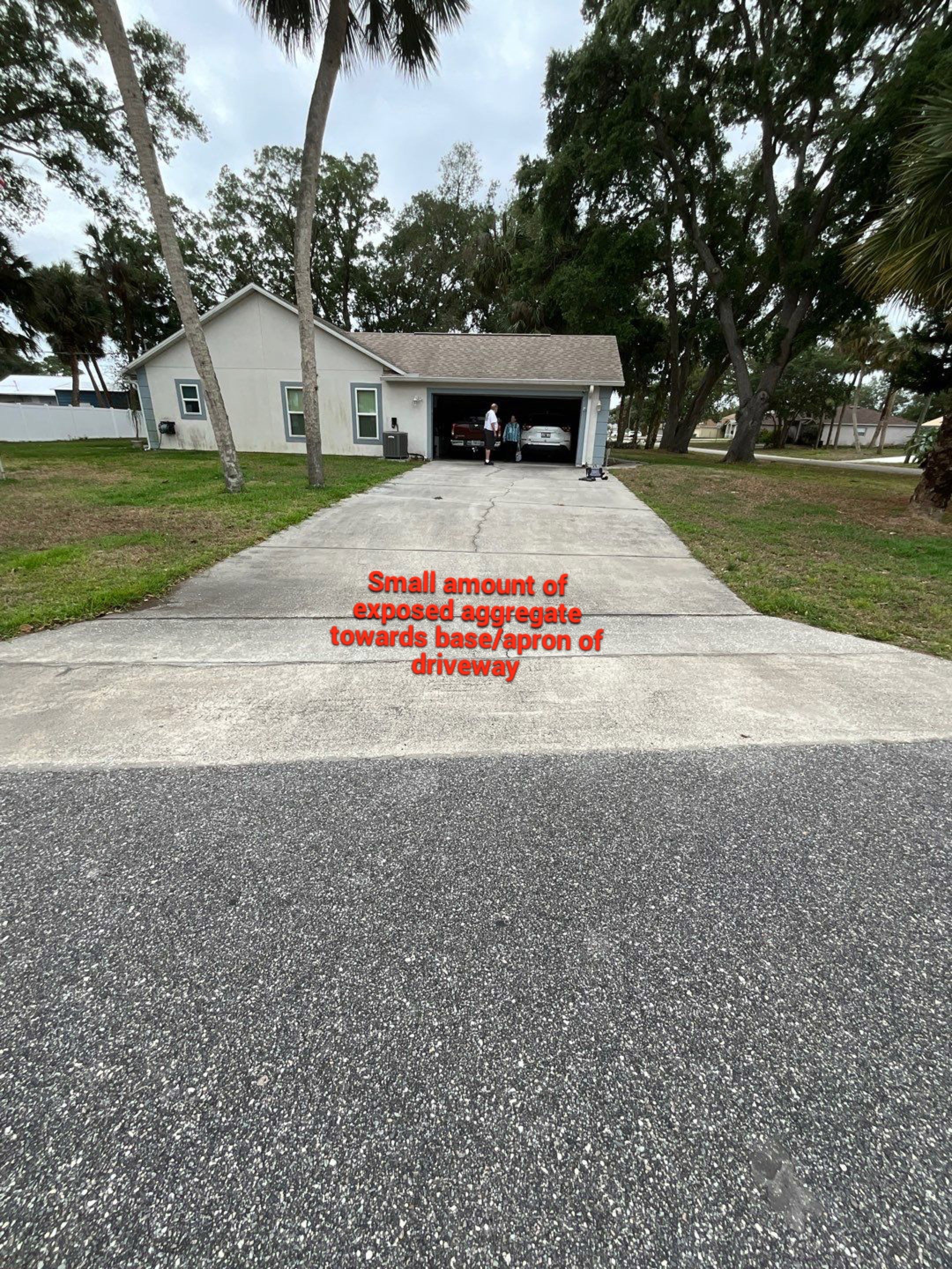 Driveway and Garage using Tidal Wave by Amvet concrete coatings llc