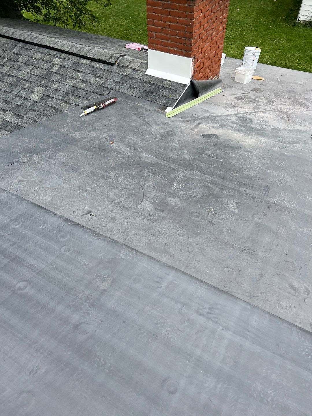 Residential Roofing Installation using 60 mil rubber roof  by Nitro Roofing and Construction
