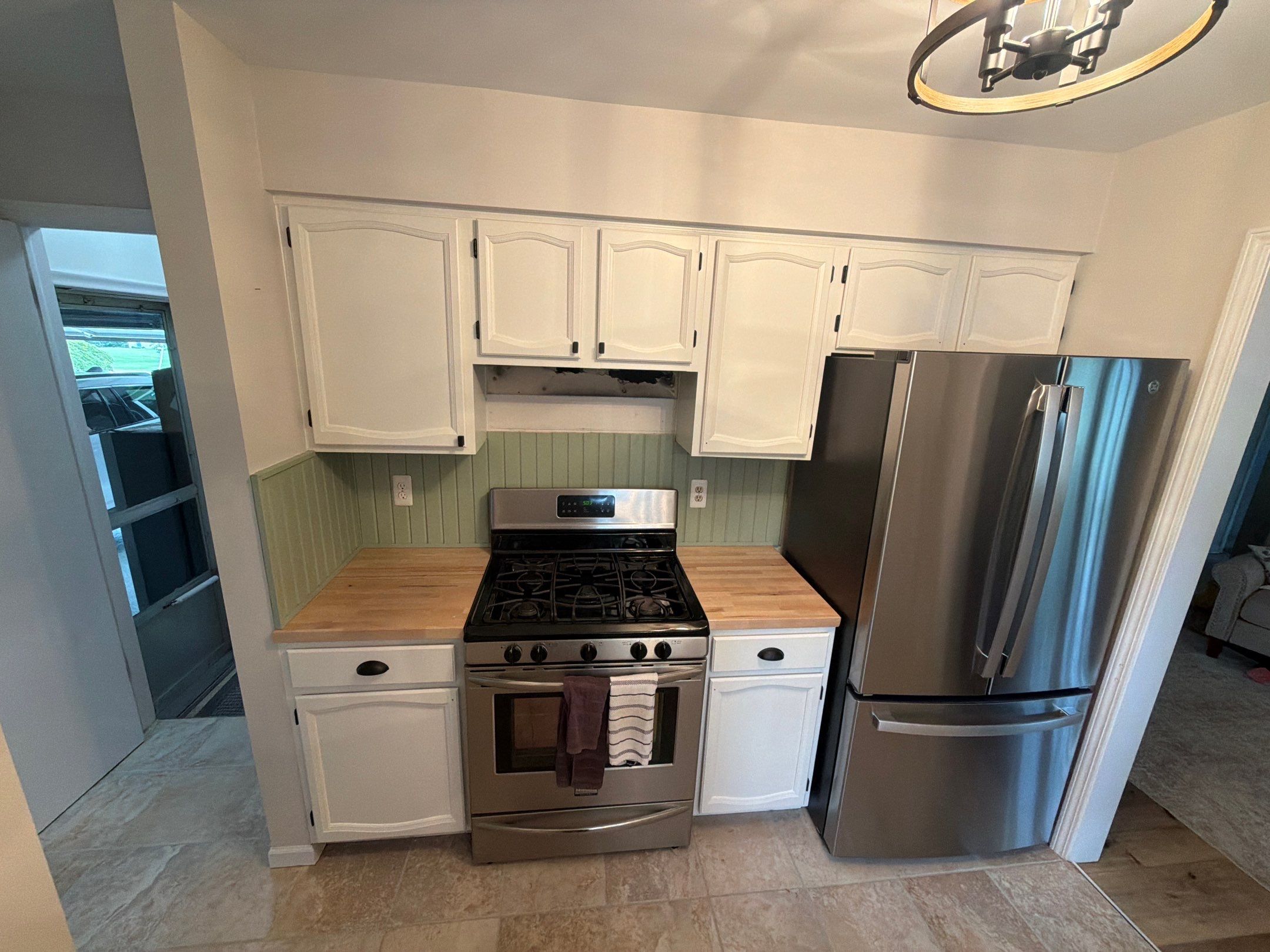Kitchen Cabinet Refinishing and Butcher Block Countertop Installation in Fenton by Top Shelf Painter