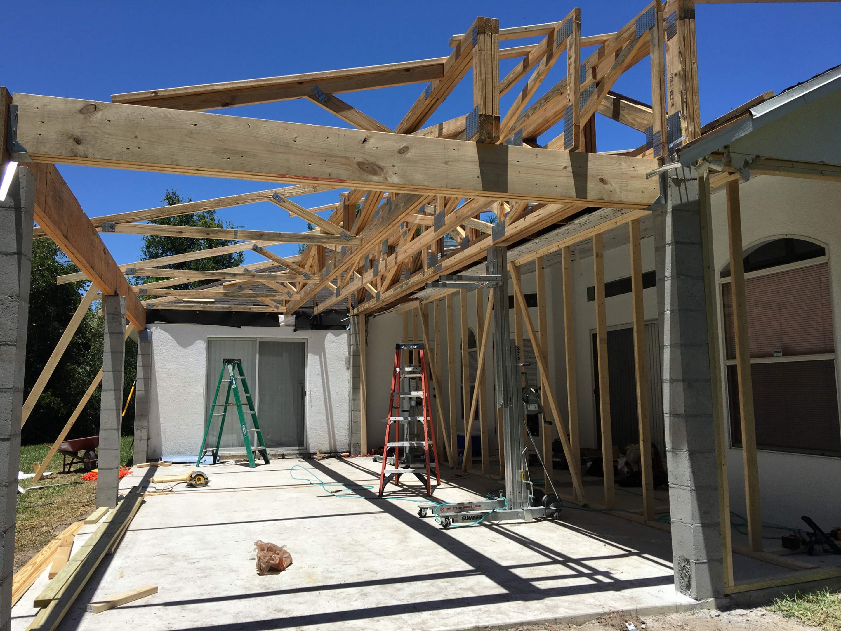 Covered Porch Extension and Structural Patio Addition in Melbourne by Florida Roofing and Renovations Inc.
