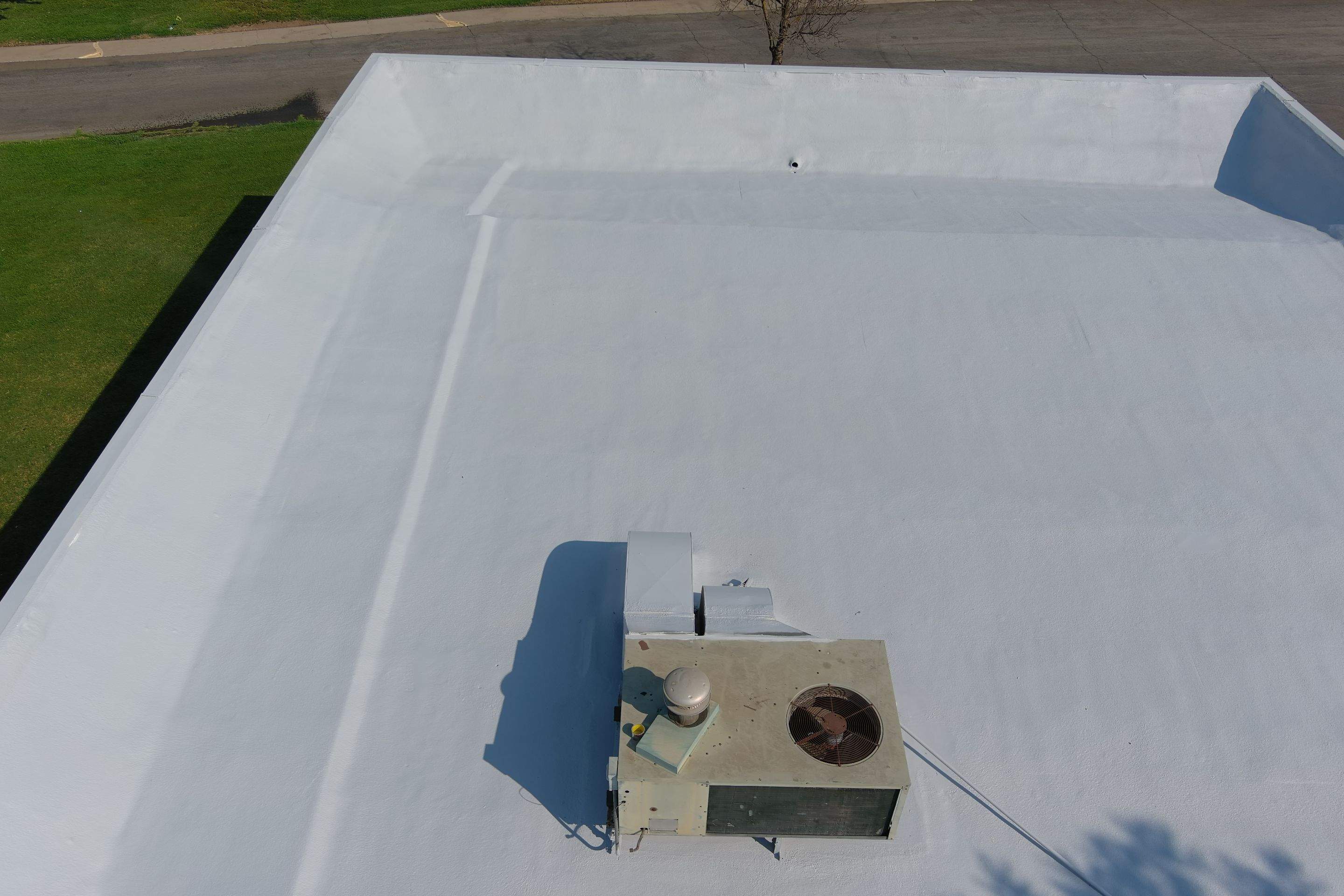 Commercial Roofing Installation using General Coatings acrylic coatings and spray foam by Straight Edge Roofing Inc