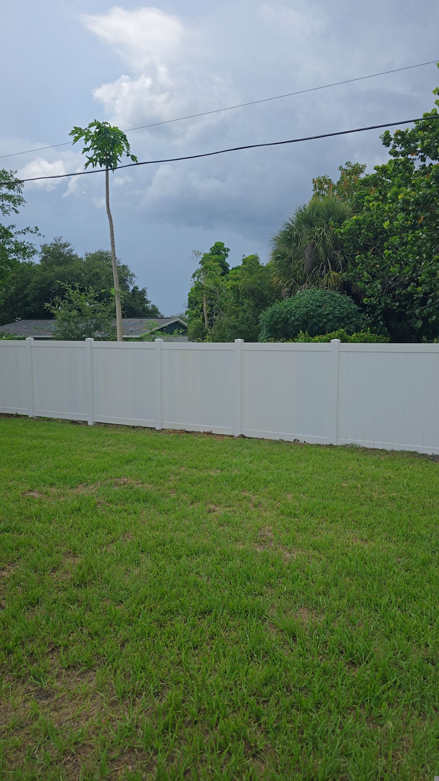 White Vinyl Privacy Fence Installation and Gate Repair in Port Charlotte by True Fence LLC