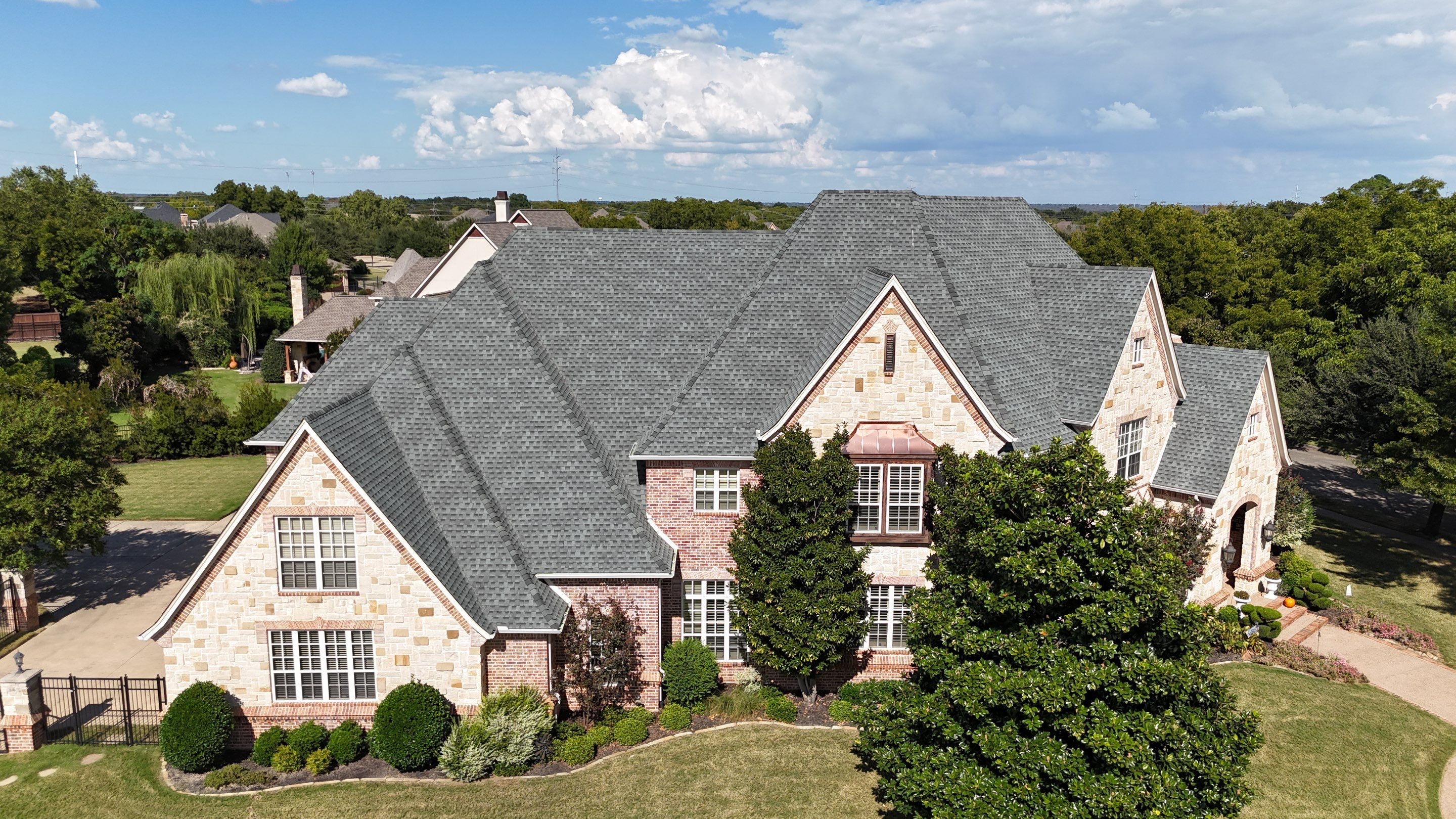 Southlake Texas Estate - Roof, Copper Awning and Gutter Project by First United Roofing & Construction