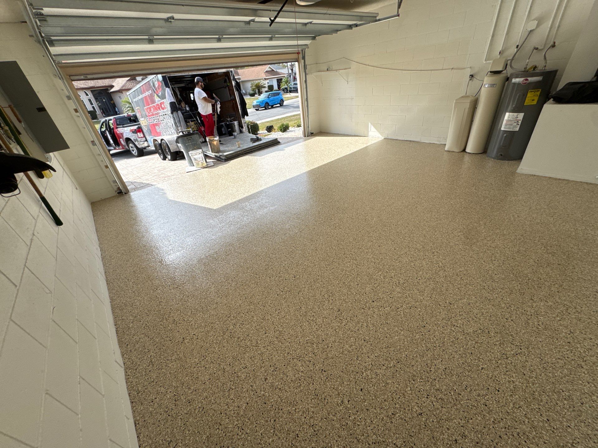 Shoreline Flake Garage with High-End Neutral Tones by Performance Floors & Coating