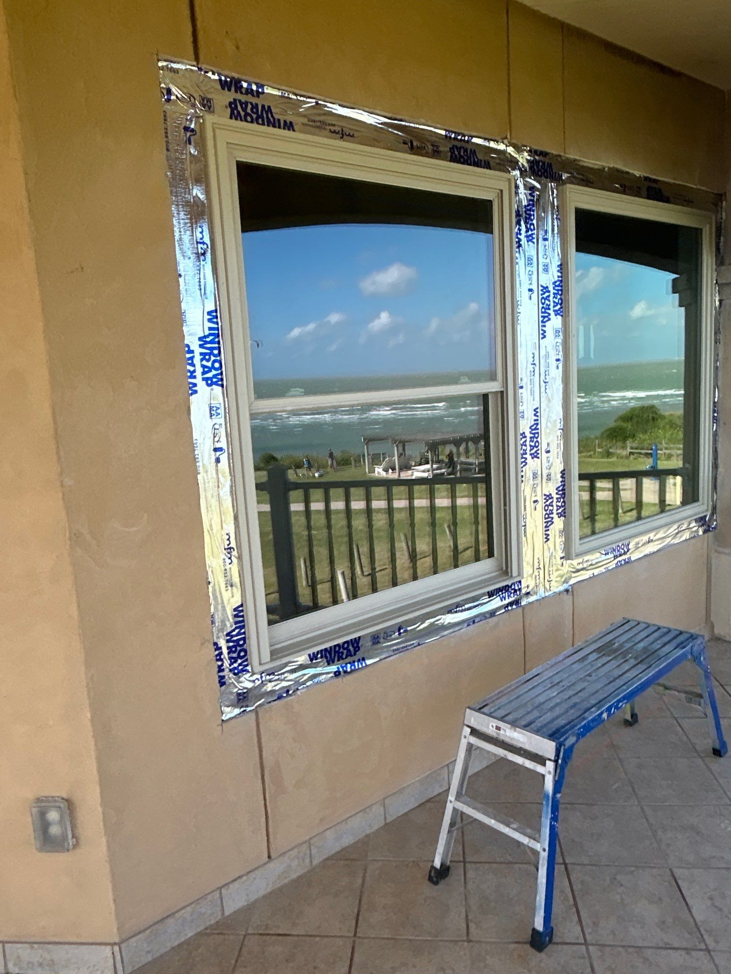 Installing Windows on a Submarine  by Bayfront Roofing and Construction