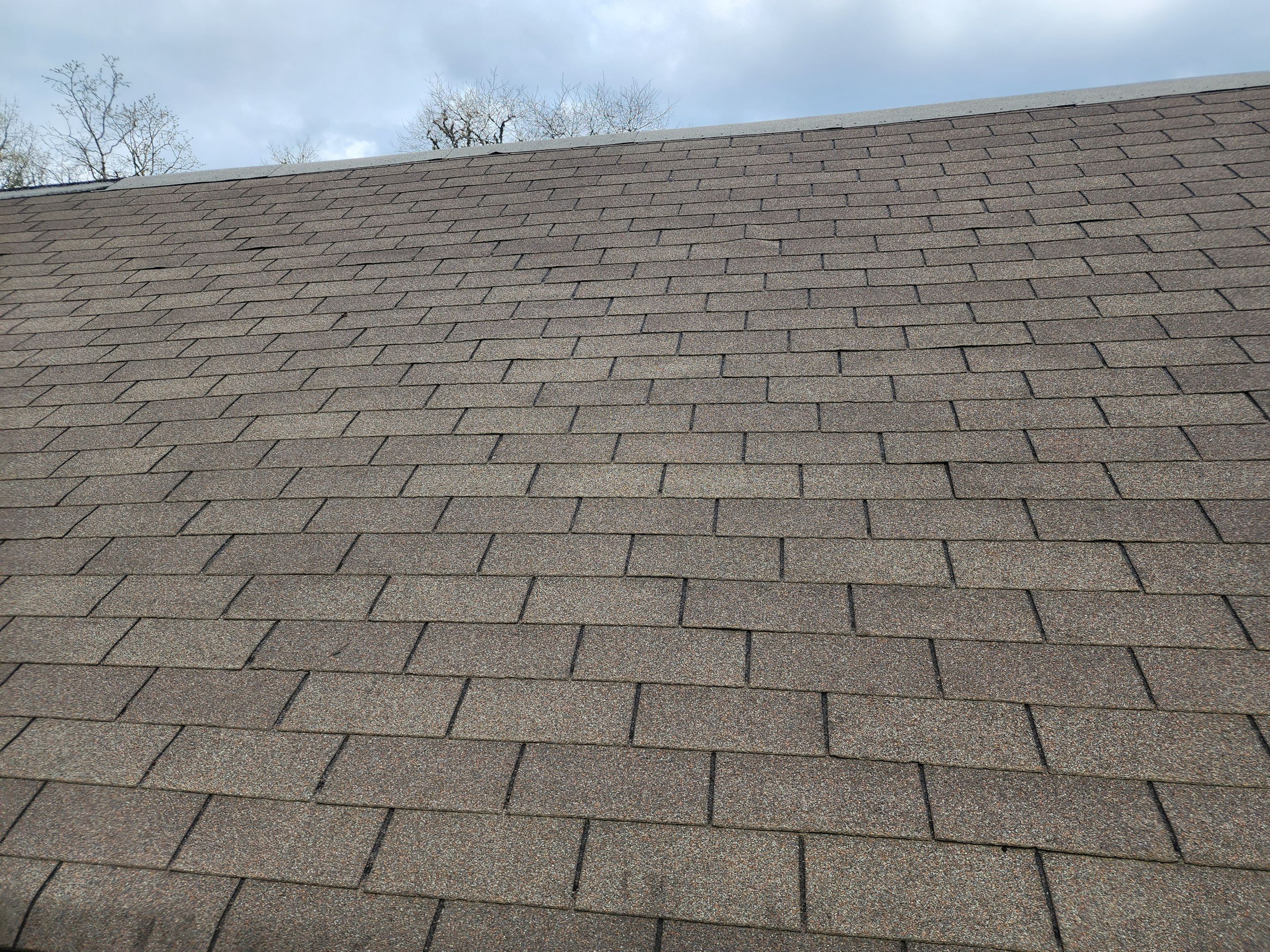 Residential Roofing Installation using 26 Gauge Colored Panels by Hostetler Roofing