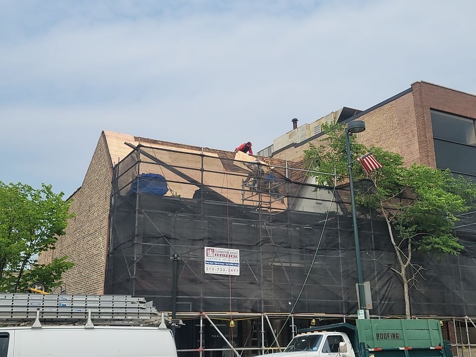 Asphalt Roof Replacement with Aluminum Gutter Installation by Custom Installations