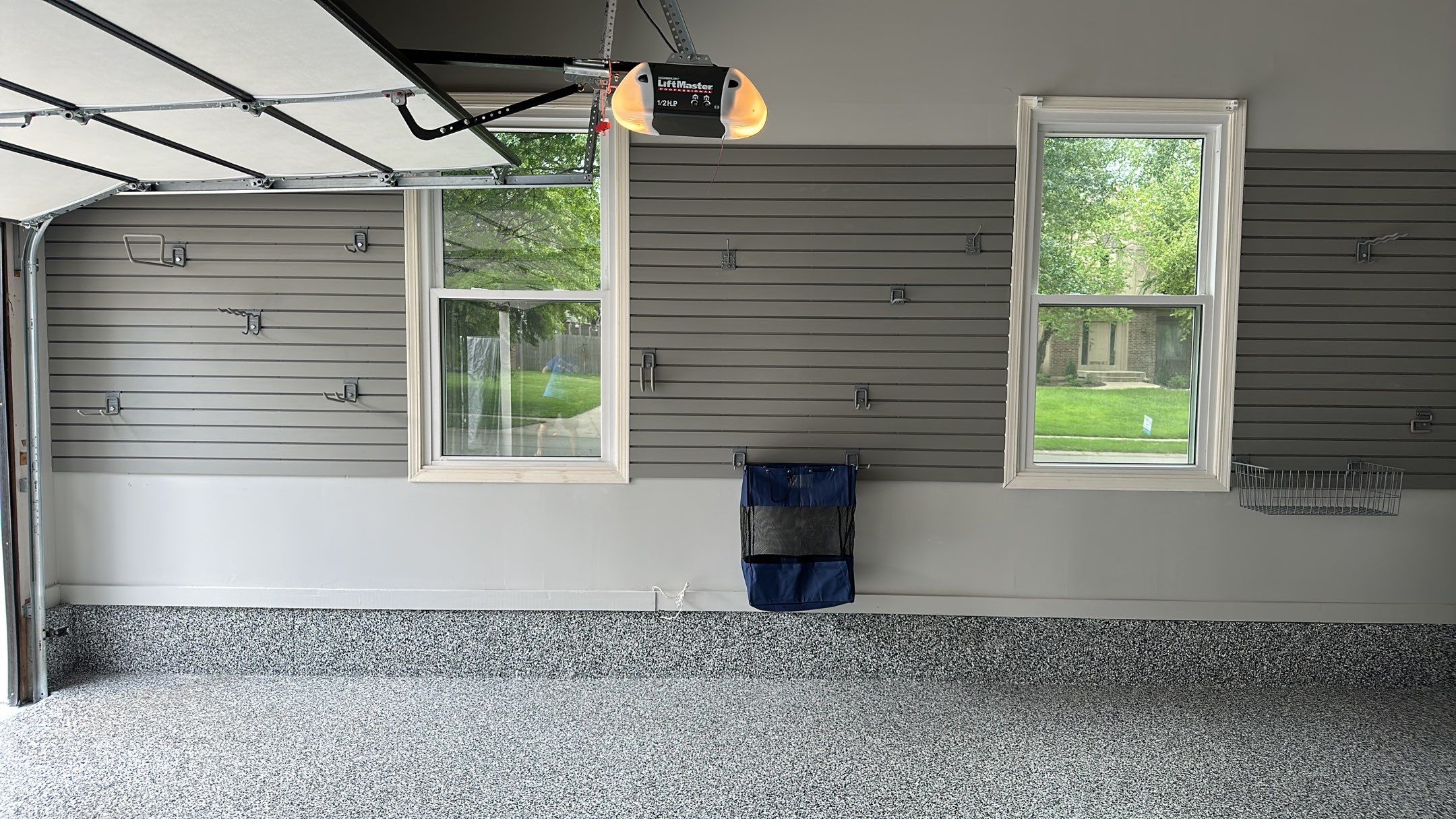 Julie H. upgraded her garage with our cabinets and wall storage options  by Banner Garage