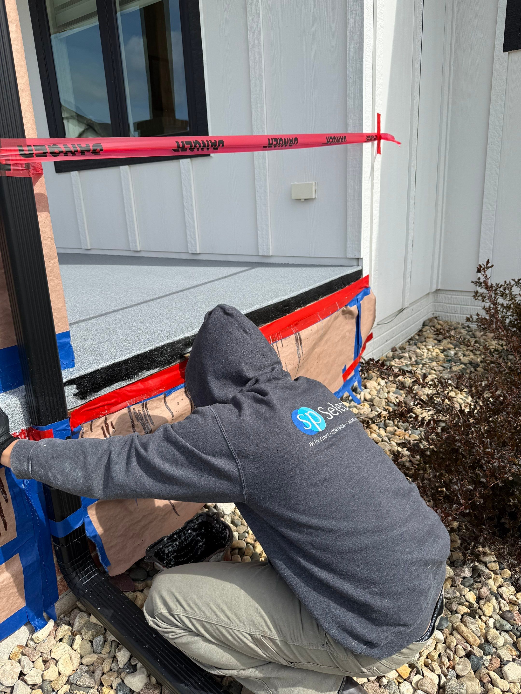 Grey Speckled Concrete Porch Coating for Sioux Falls Home by Select Painting, Coatings & Garage Cabinets