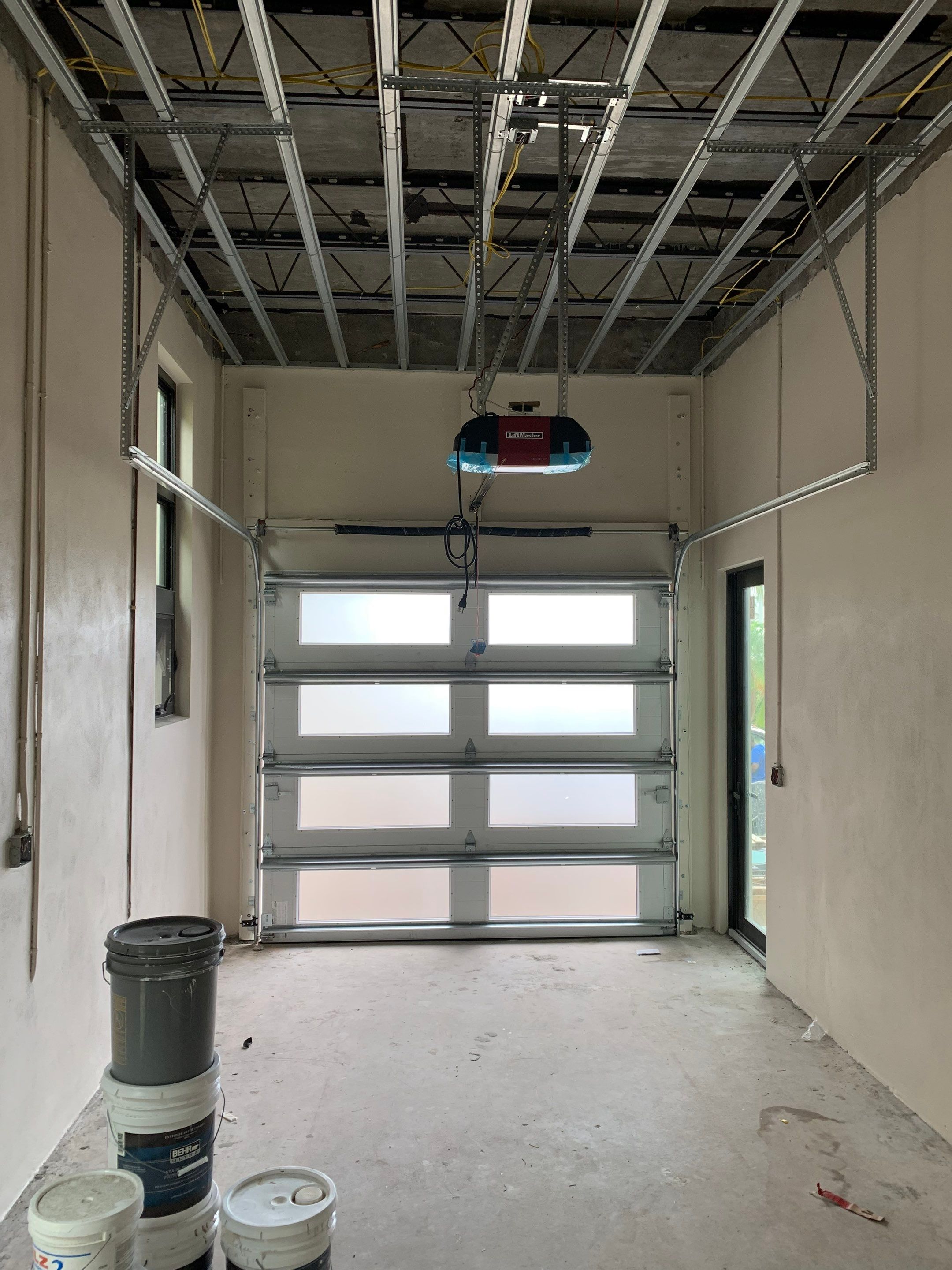 Modern Garage Door Installation for New Construction – Las Olas Isles, Fort Lauderdale, FL by The Door Doctor of South Florida, Inc.