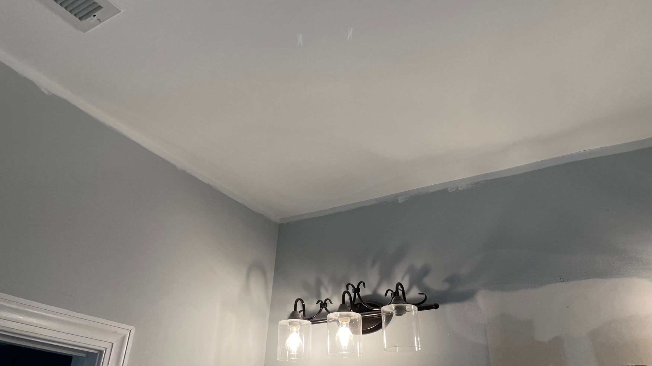 Bright Bathroom Remodel with Wall Removal, Stand Alone Tub and New Vanity by Footprints Floors of Coastal Carolina