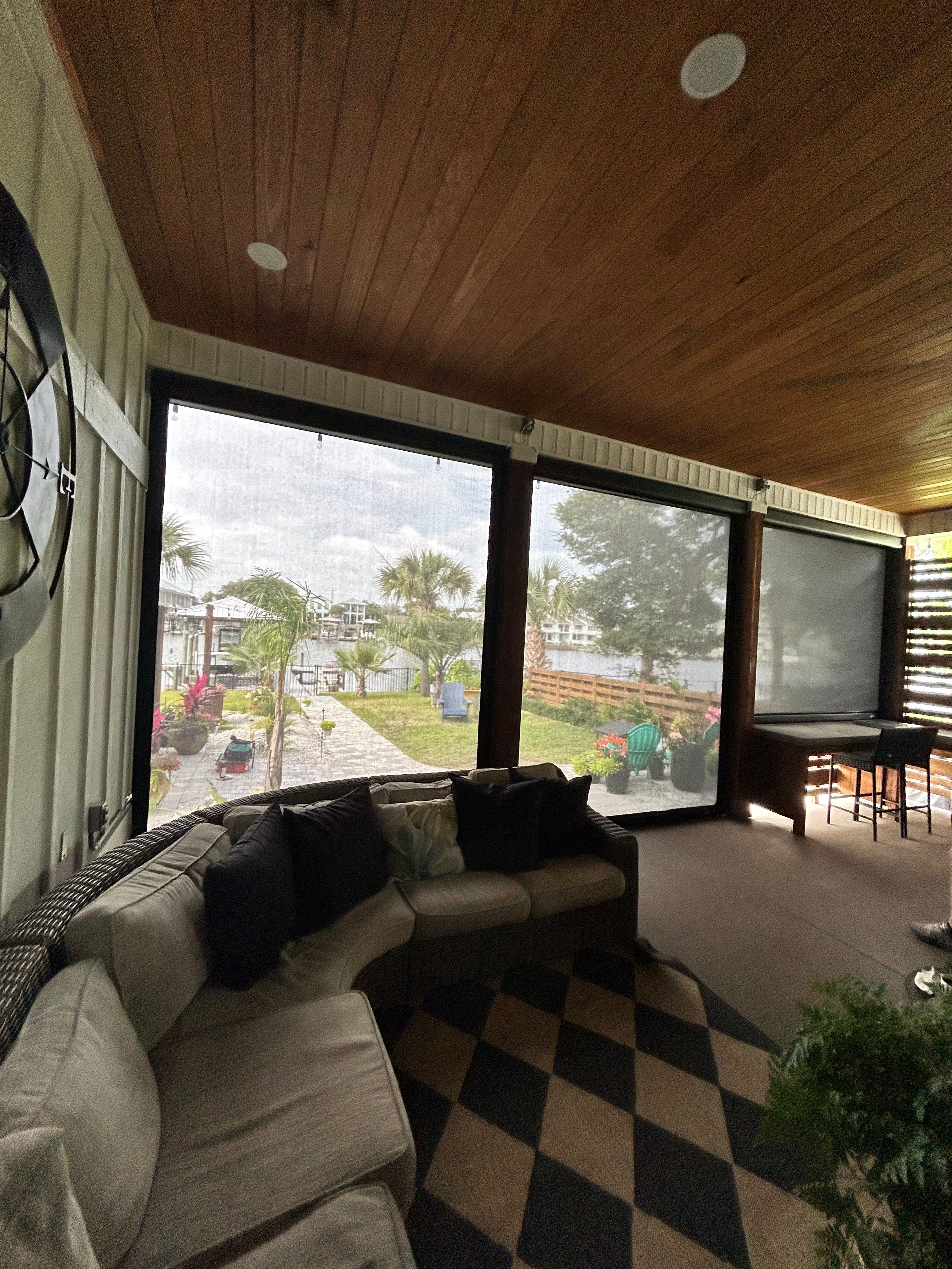 Motorized Fenetex Screen Installation for a Panama City Outdoor Patio by Brannan Aluminum Inc.