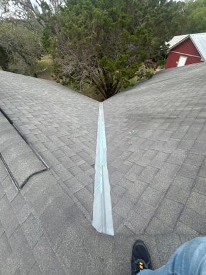 Wide view of completed asphalt shingle roof valley