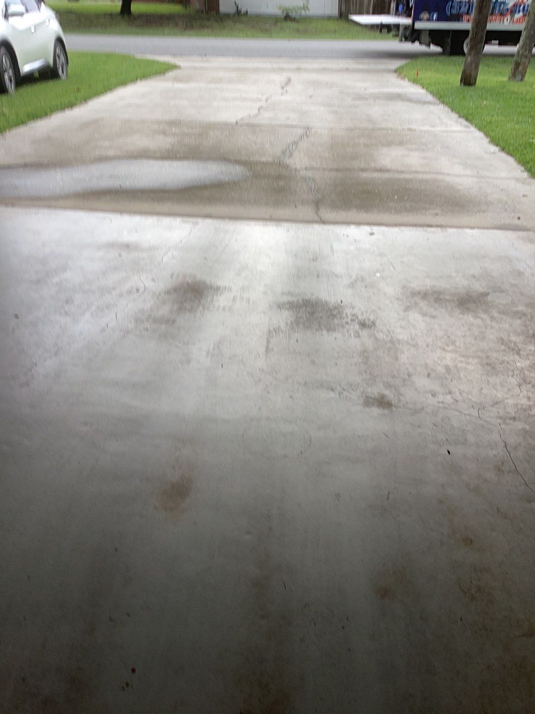 Driveway and Garage using Tidal Wave by Amvet concrete coatings llc