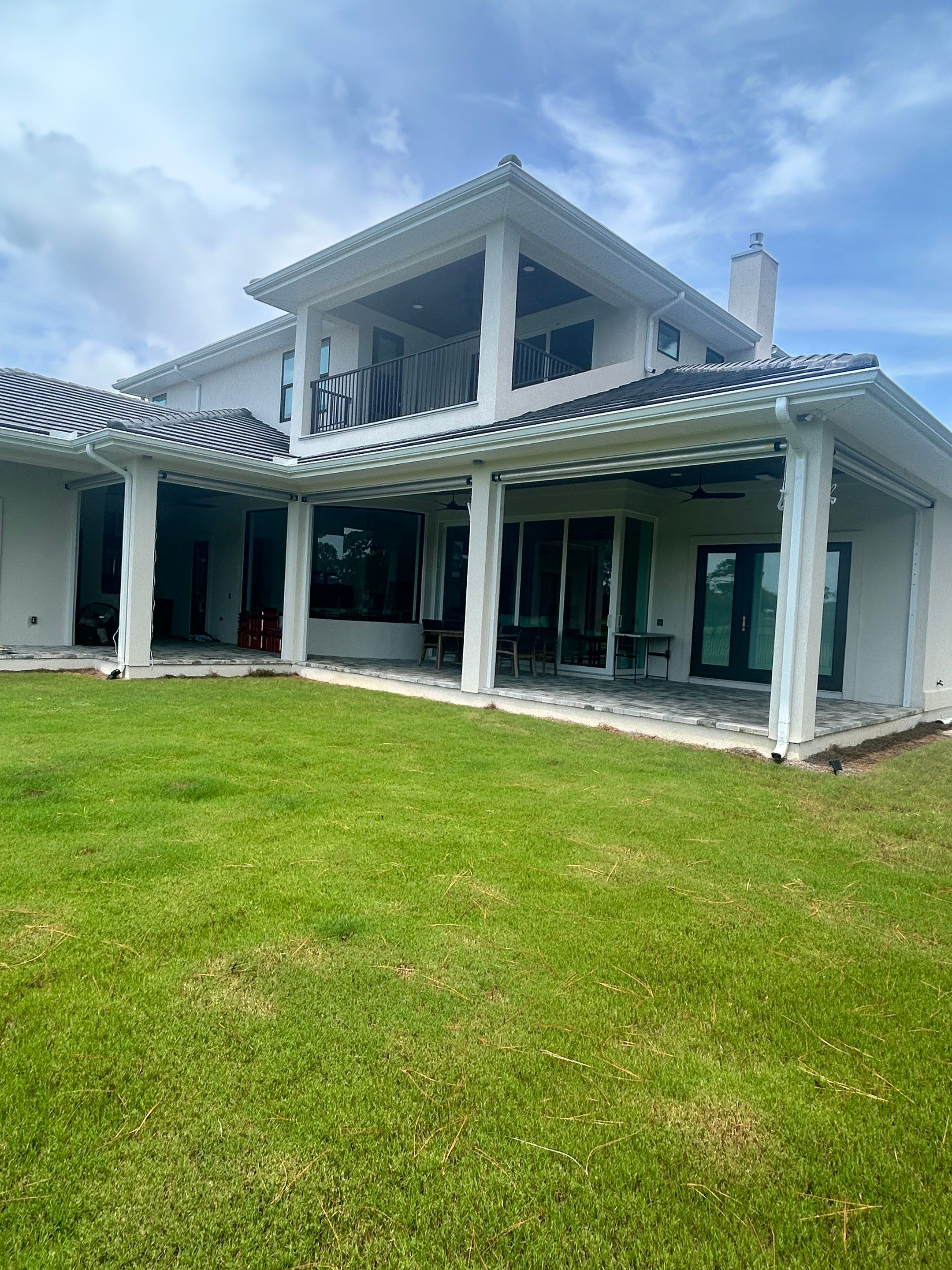 Motorized Screen and Solar Shade Installation in Panama City Beach by Brannan Aluminum Inc.