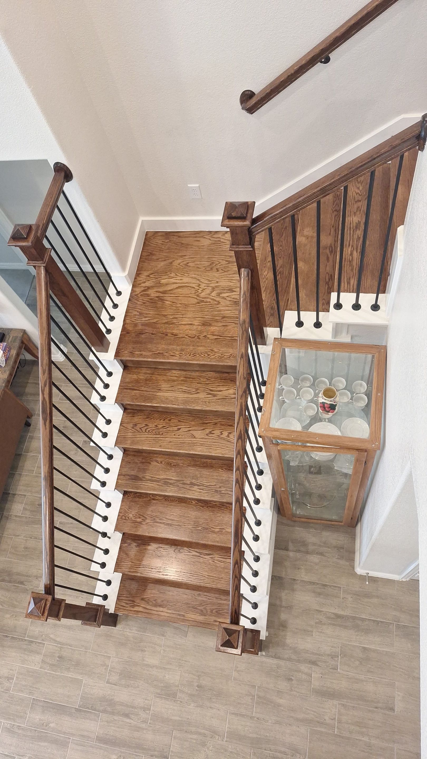 Carpet replacement with Tile and Red Oak Stairs by EL-GC LLC 