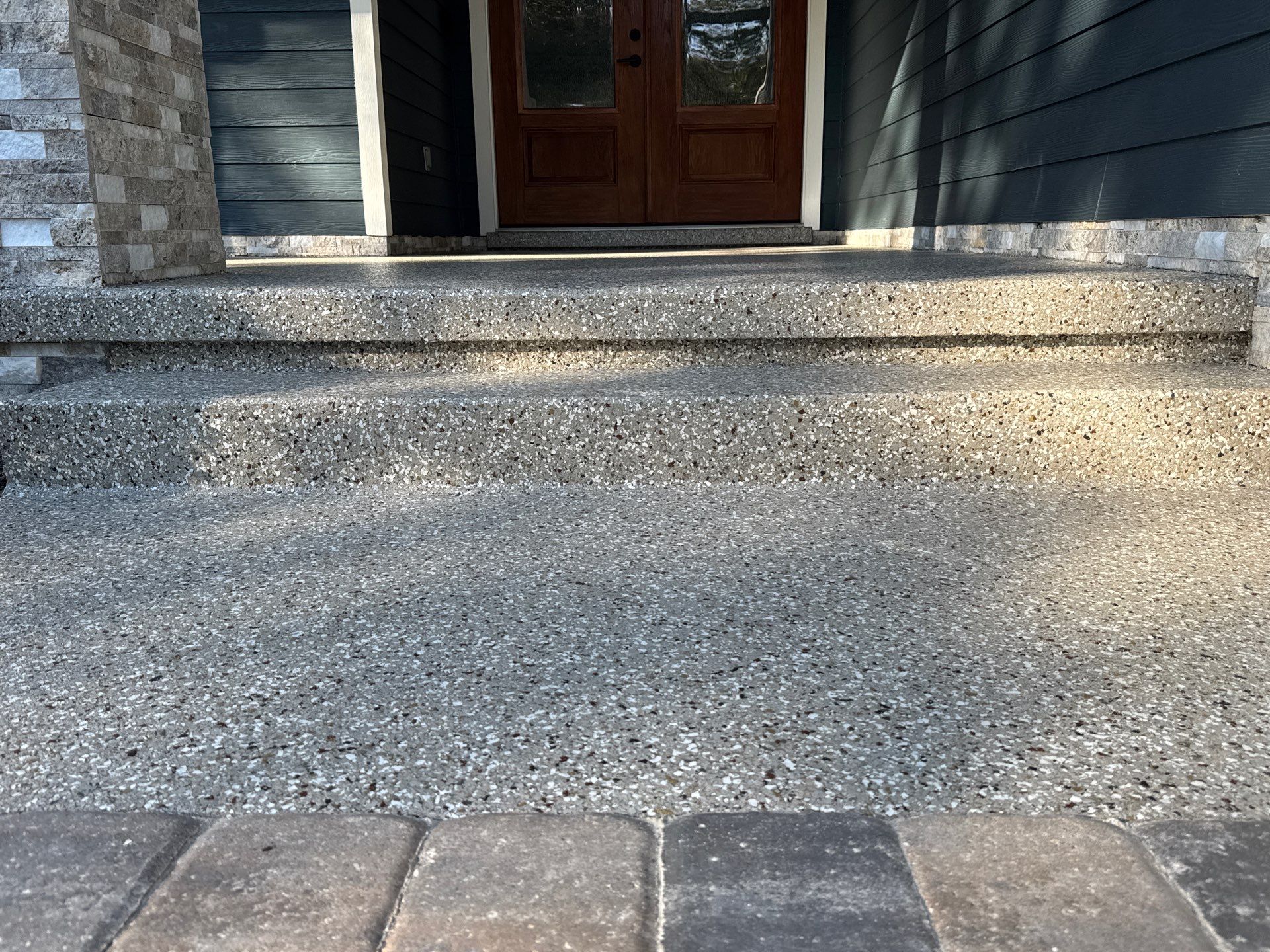 Front and Back Porches in Chiefland, FL in Pebble Beach by Cross Creek Concrete Coatings