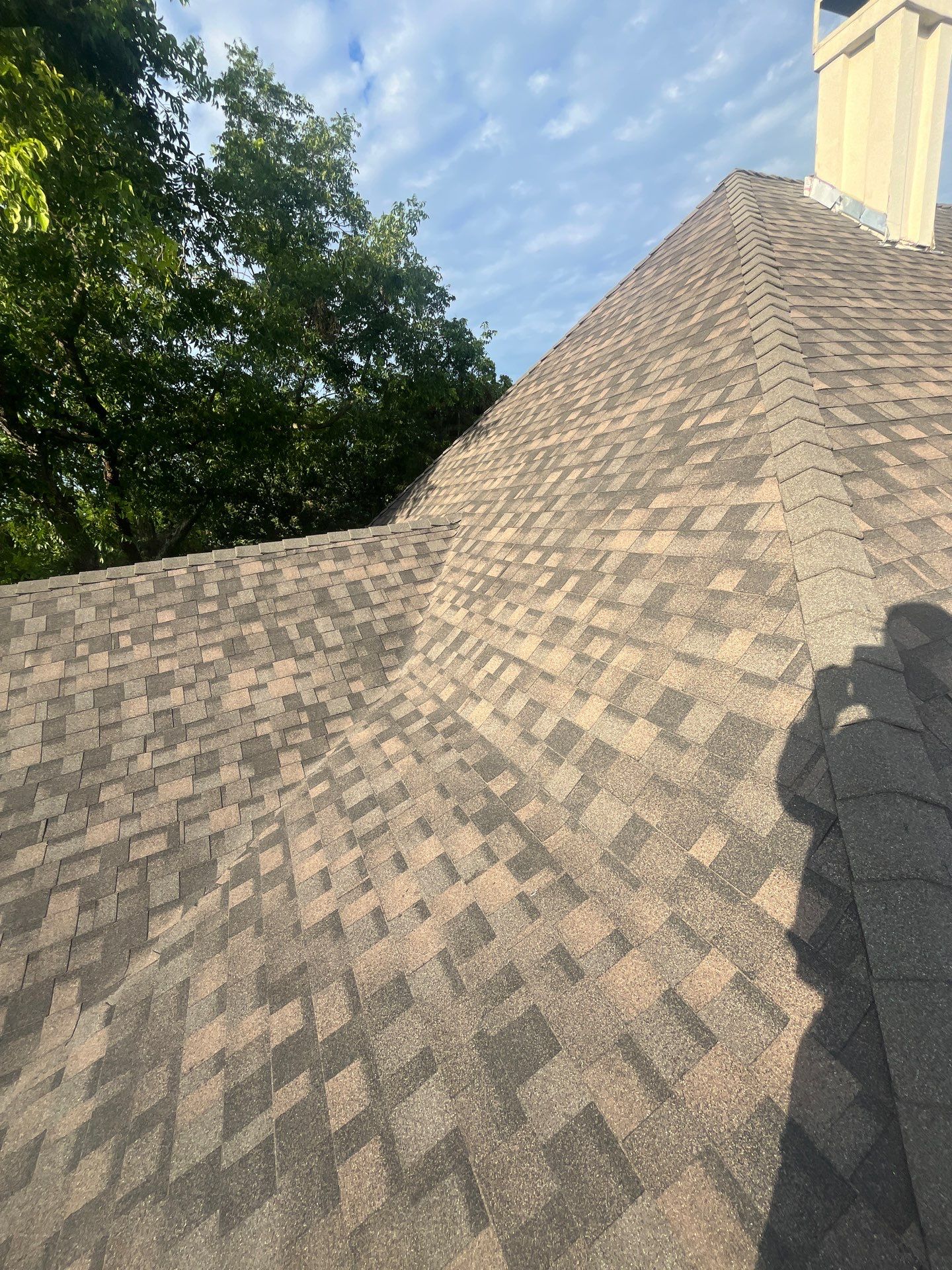 Tan exterior with IKO Driftshake by Tejas Roofworks + Restoration