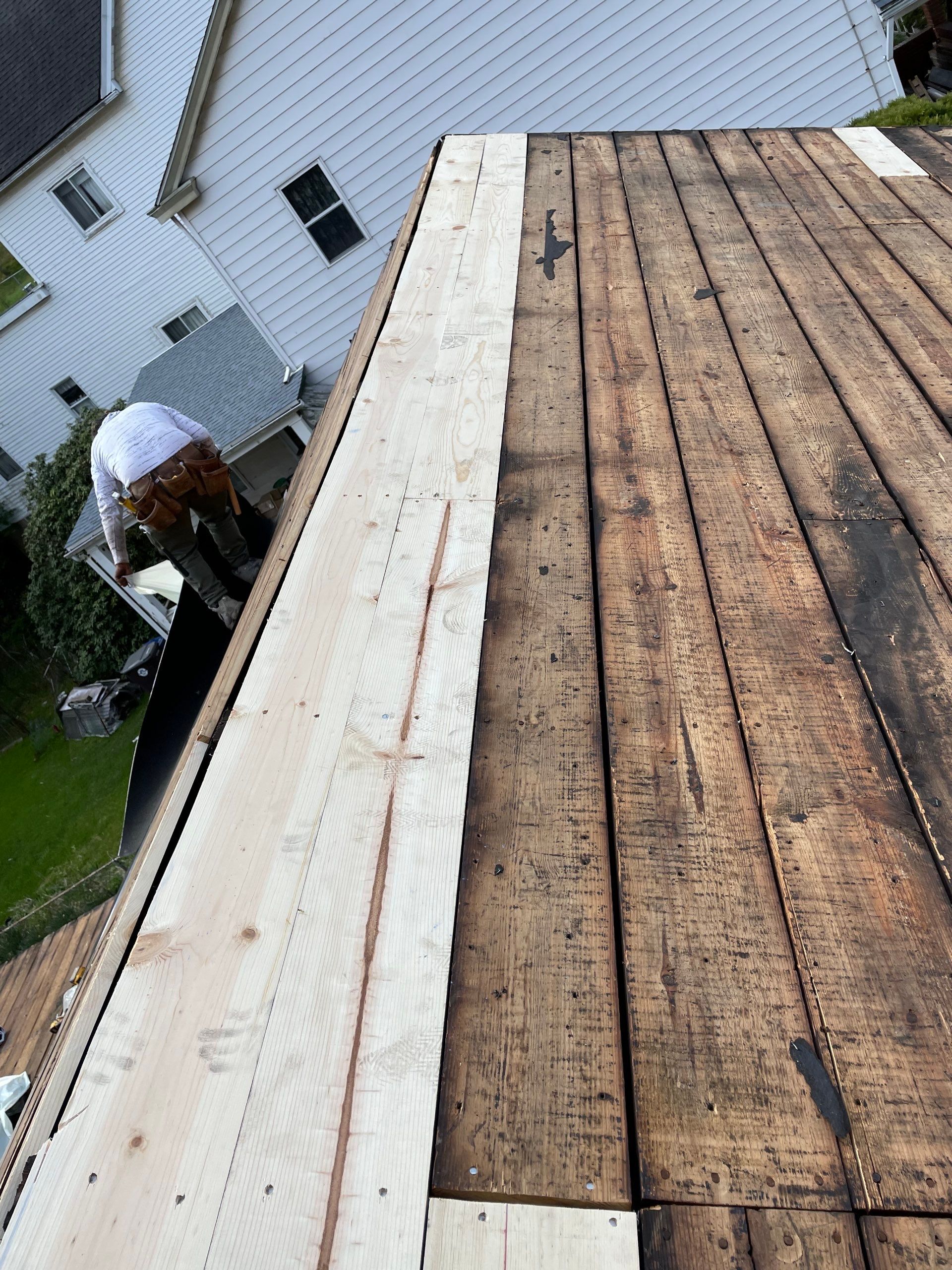 Roof sunspace deck  by Cousins Roofing Siding & Decks