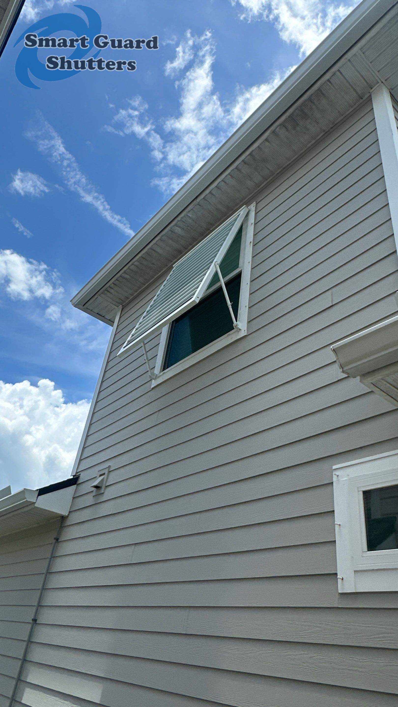 Impact Bahama Shutters in Signal White by Smart Guard Shutters
