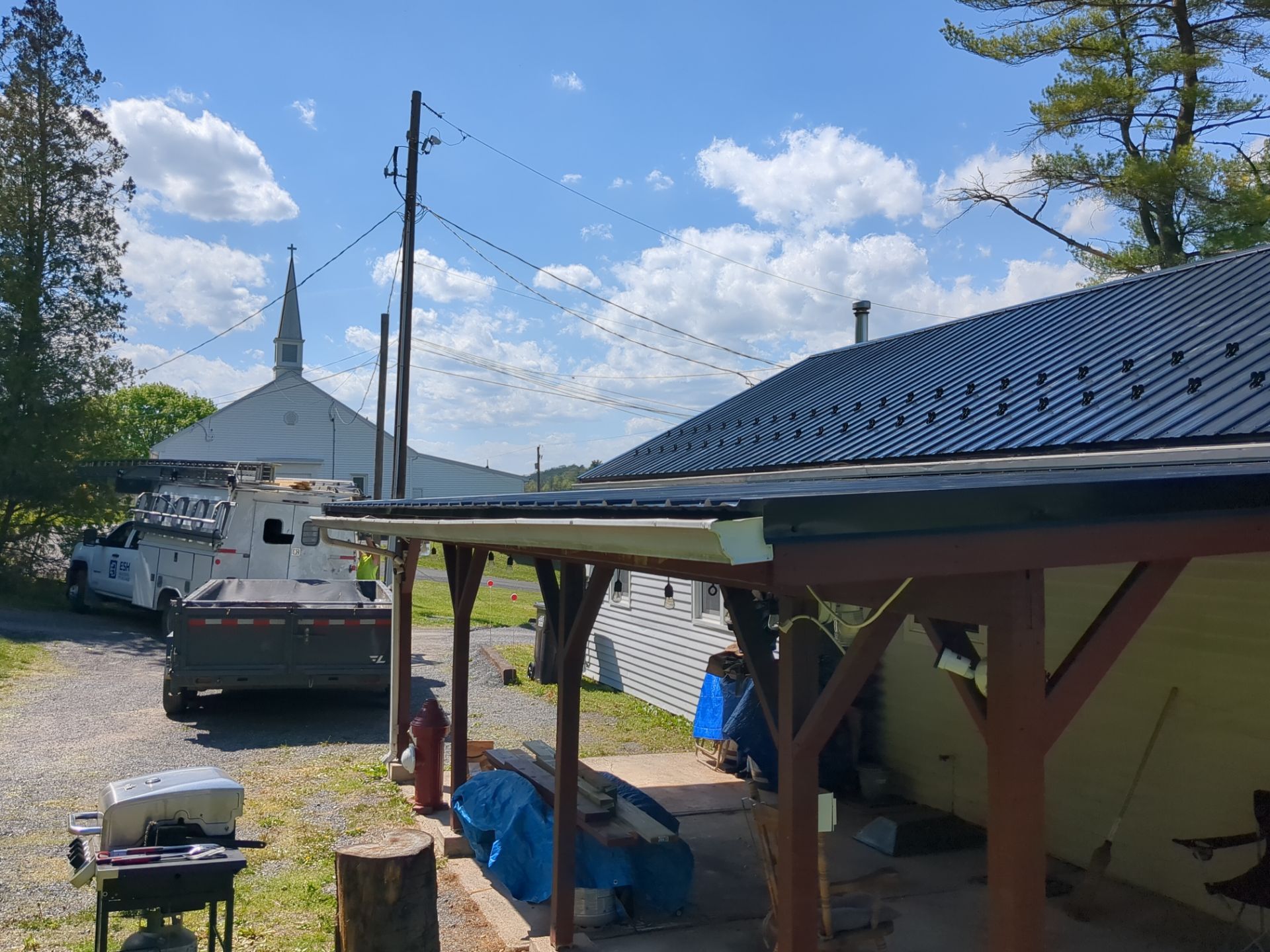 Black ABM Metal Roof Replacement  by Esh Builders