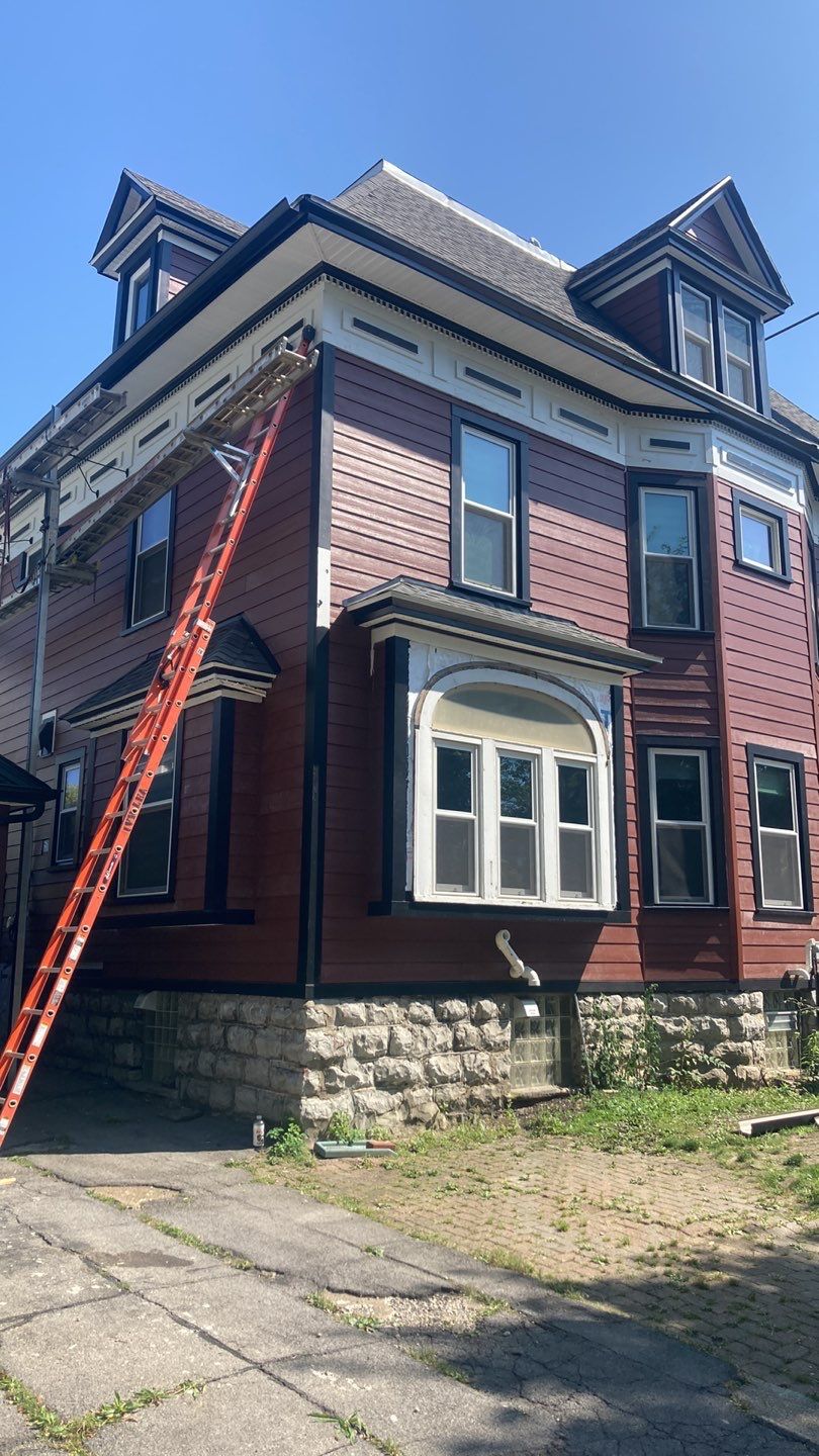 Exterior Renovations- Siding, Stamped Concrete, Porch, and Railings by Ivy Lea Construction