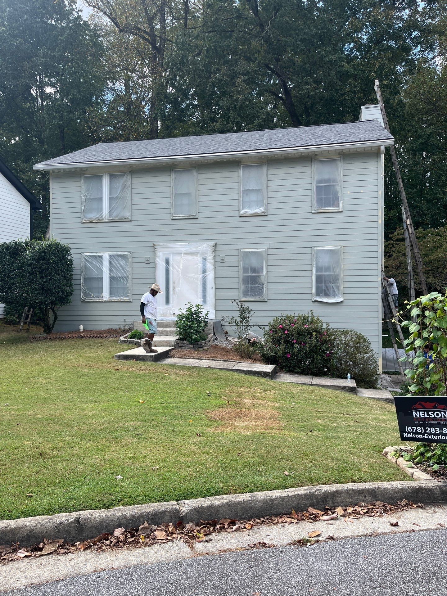 James Hardie Siding Replacement and Pressure Treated Pine Deck Resurface  by Nelson Exteriors 