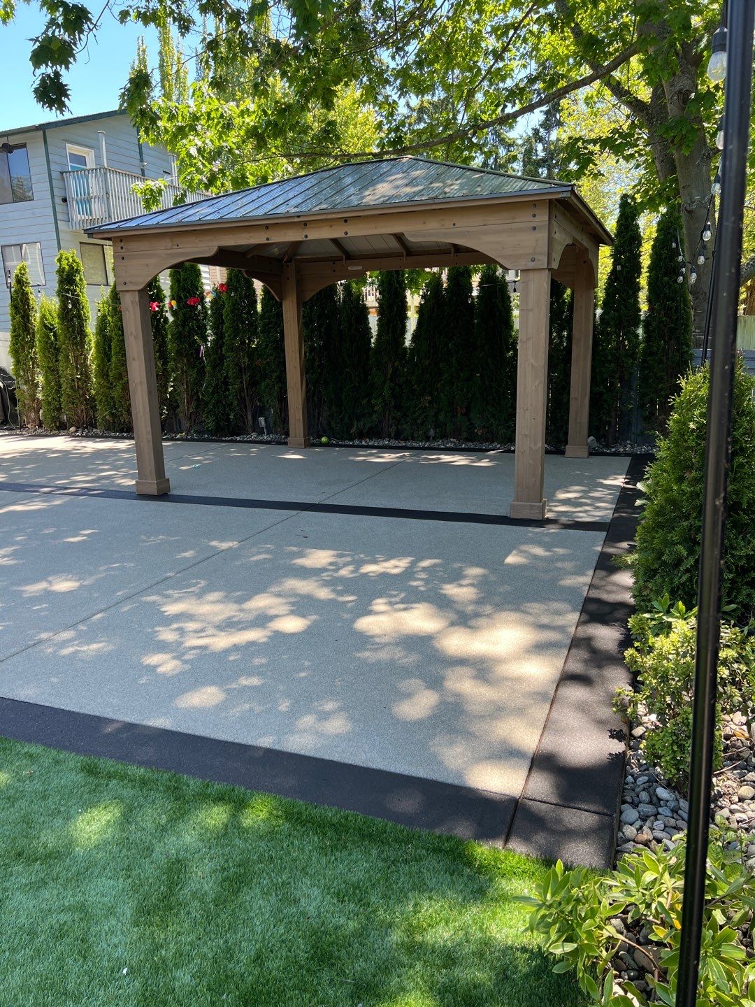 Patio Installation using Concrete, Retaining walls, and Turf install by Jireh Asphalt & Concrete Inc 