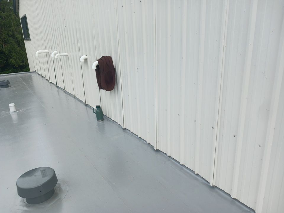 Residential Shop flat roofing Installation using Durolast membrane by Top Notch Roofing Inc